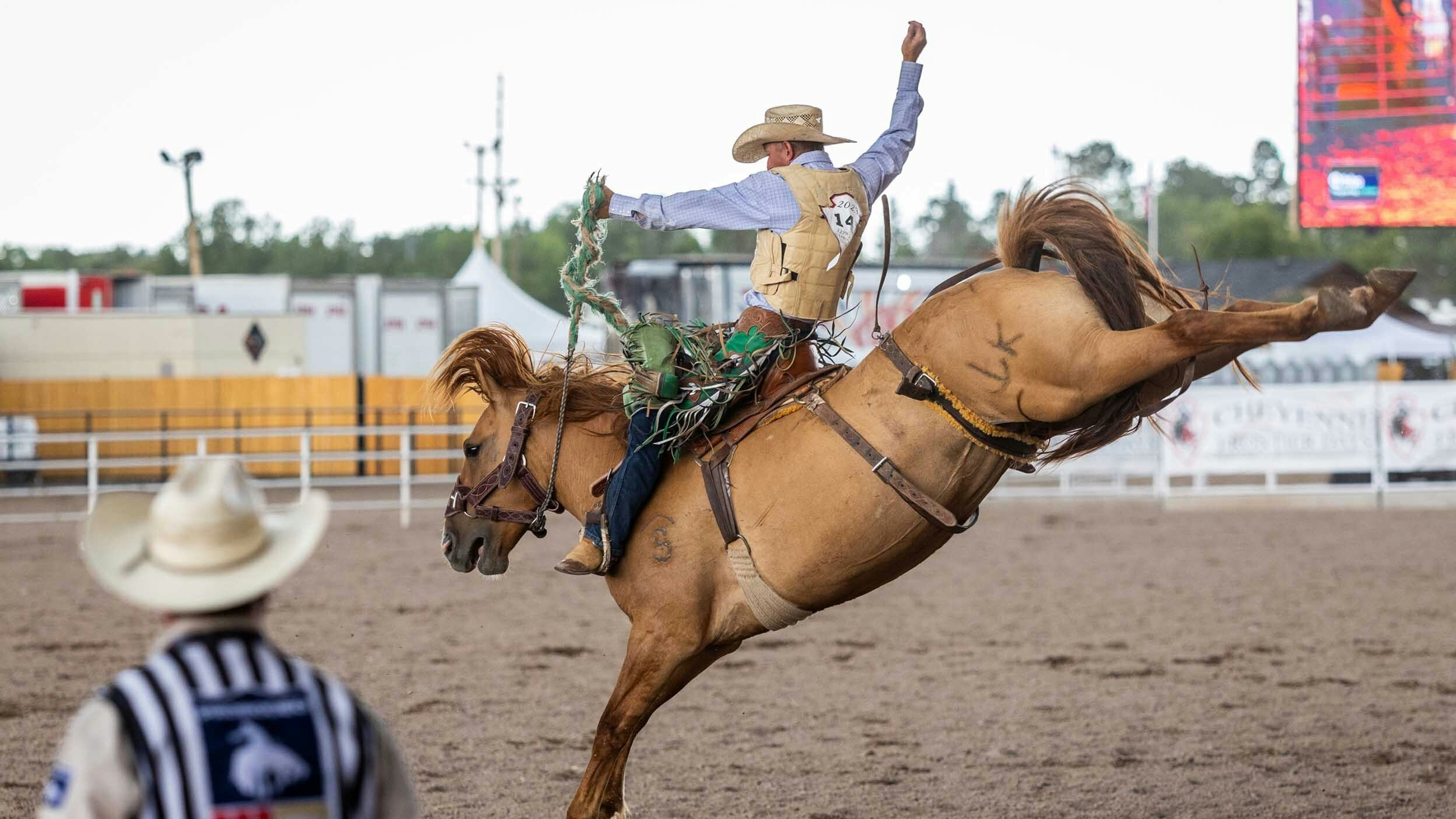 Allen Boore from Axtell, UT rides his horse in the Saddle Bronc Riding for a score of 84 points at Cheyenne Frontier Days on July 28, 2023.