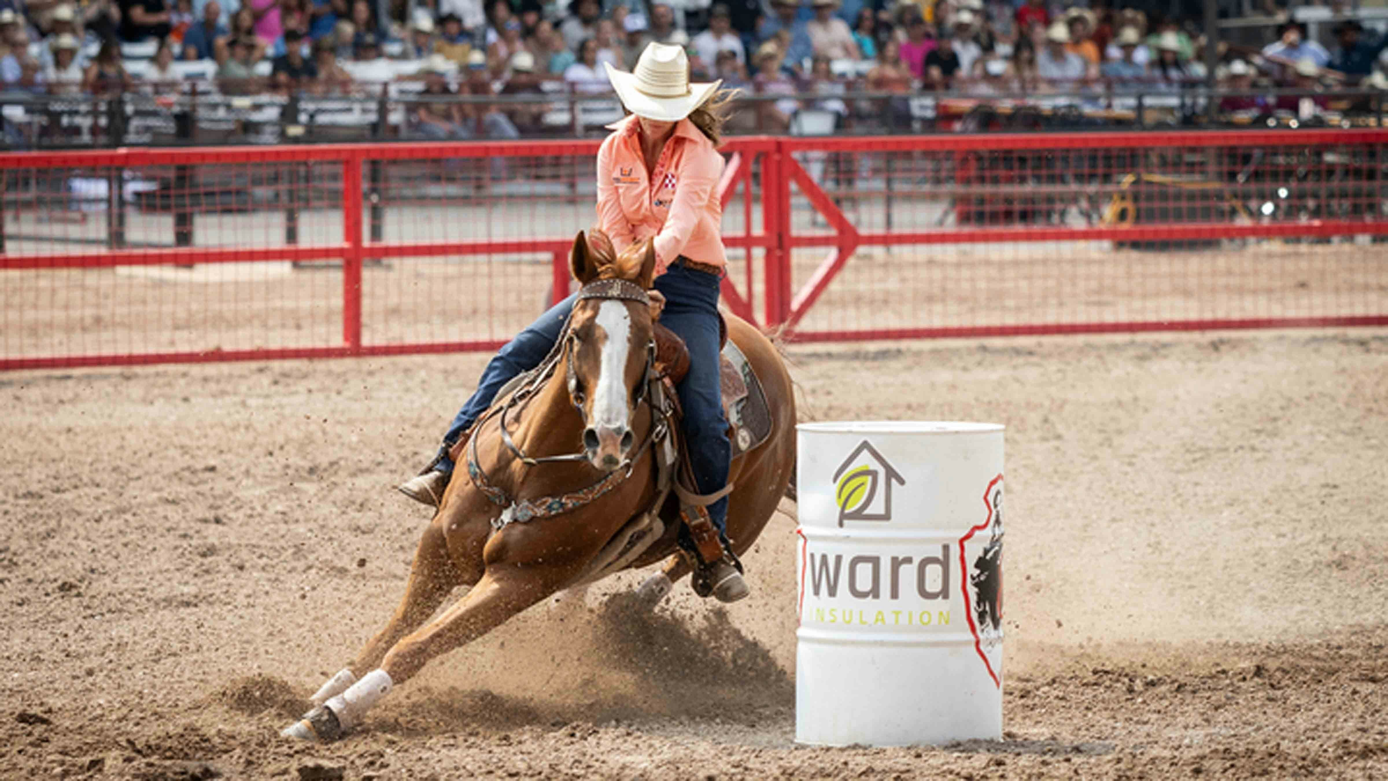 Andrea Busby from Brock, Texas goes around the 3rd barrel in the barrel racing at Cheyenne Frontier Days on July 24, 2024