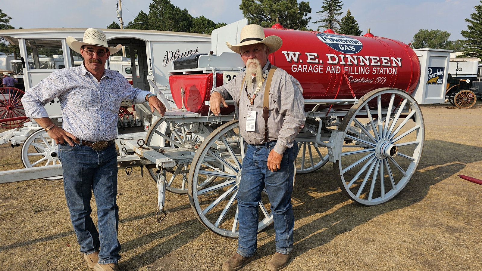 From left, Mike Stein and Mike Gill, pose with the firehouse carriage that Gill drove in the Cheyenne Frontier Days parade. The two have driven team horses in the movie, "1883," but they consider the Cheyenne Frontier Days parade more of a bucket list item, because of all its cool historical carriages.