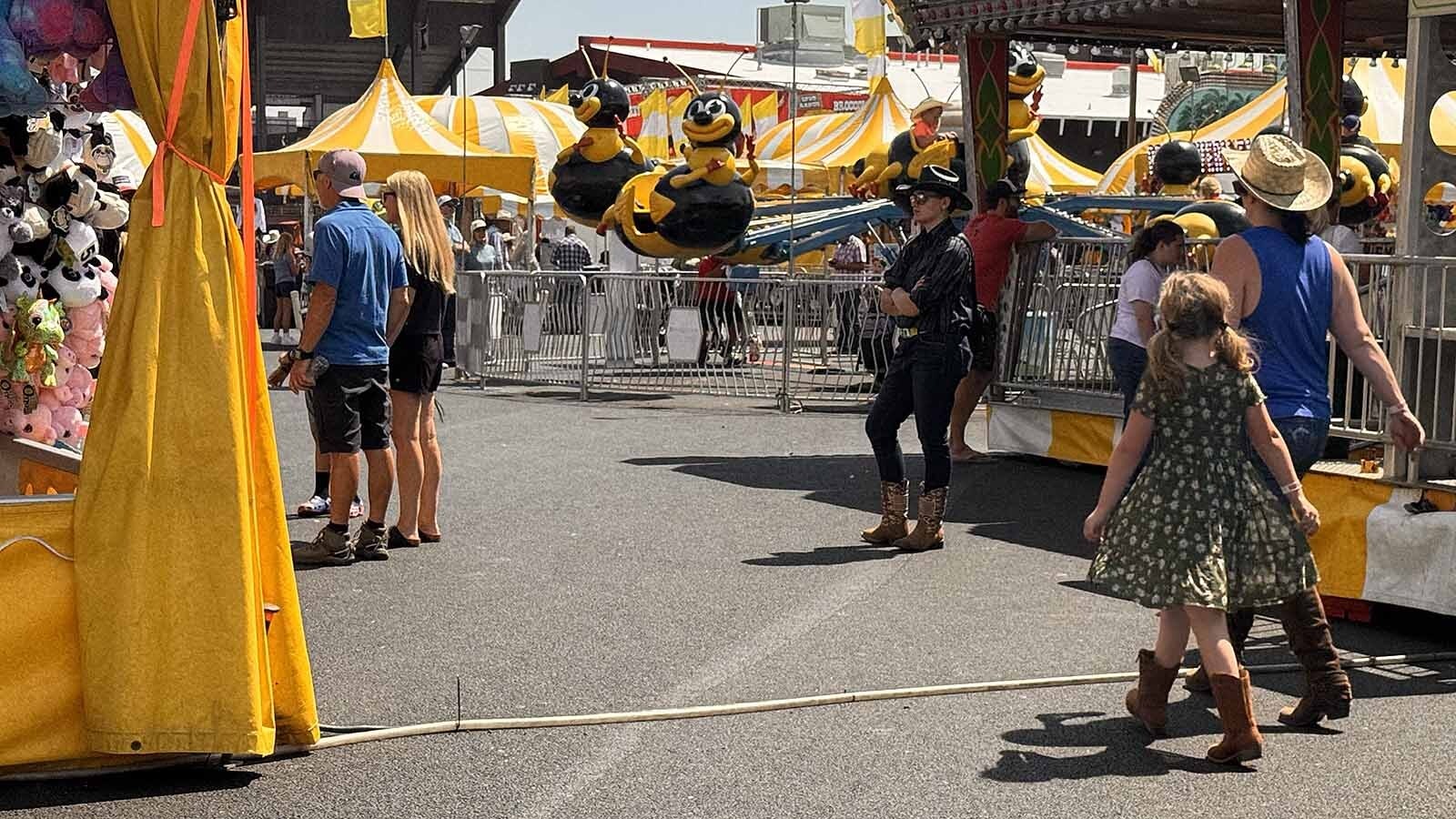 This image checks off two squares of CFD Bingo: jeans tucked into boots, and boots with shorts. While tens of thousands of out-of-state visitors flock to Cheyenne Frontier Days every year, locals love it too. And one of the more popular things they do is play CFD Bingo, a light-hearted game of spot the stereotype.