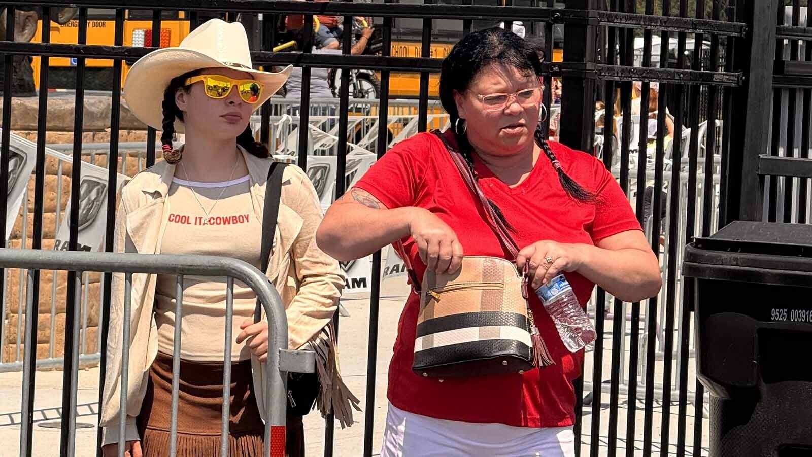 Leela Costin, 14, of Illinois, left, with her fringe jacket and skirt, said she loves all things country. While tens of thousands of out-of-state visitors flock to Cheyenne Frontier Days every year, locals love it too. And one of the more popular things they do is play CFD Bingo, a light-hearted game of spot the stereotype.