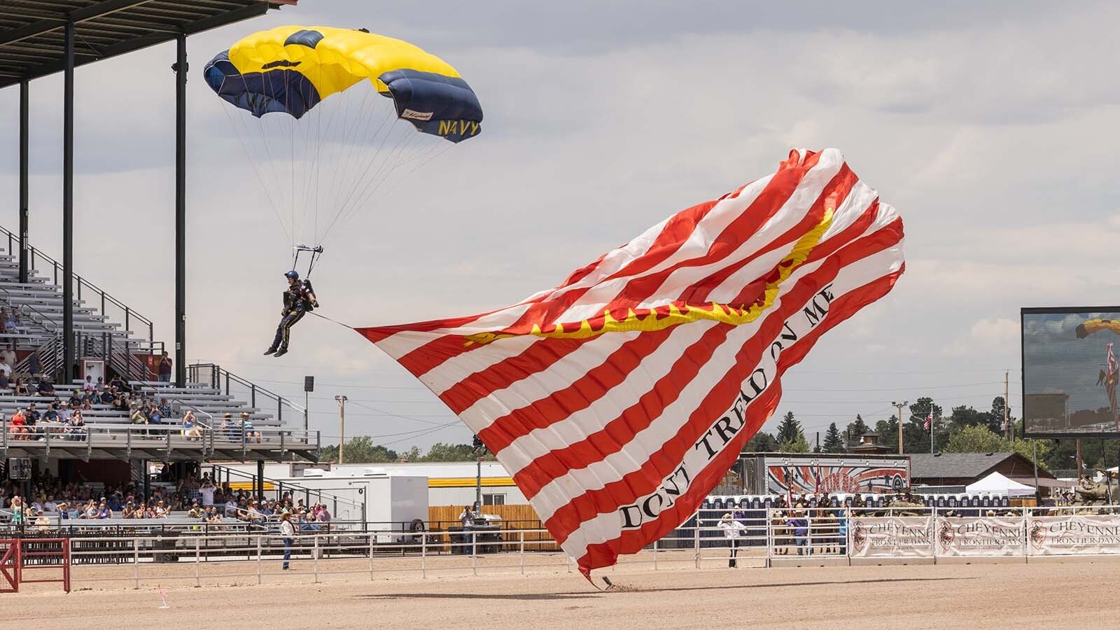 The opening ceremonies for the Cheyenne Frontier Days Rodeo features a parachuter wiuth a large "Don't Tread on Me" American flag. As states gear up for America’s 250th birthday, Wyoming is planning a huge statewide Westen blowout. Old West icons, outlaws, historic trails, and a slate of uniquely Wyoming events will call to tourists seeking Western adventures.