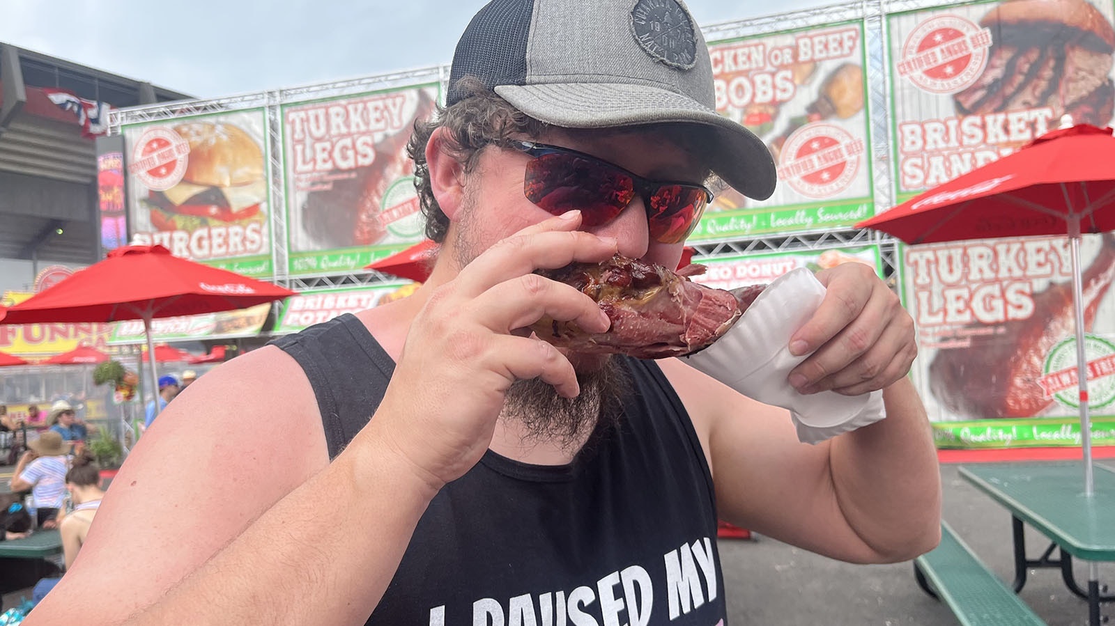Maryland resident Charles Zentgraft bites into a $20 turkey leg at Cheyenne Frontier Days on Thursday. He said the leg was overpriced, and rated it a 7 out of 10 for taste.