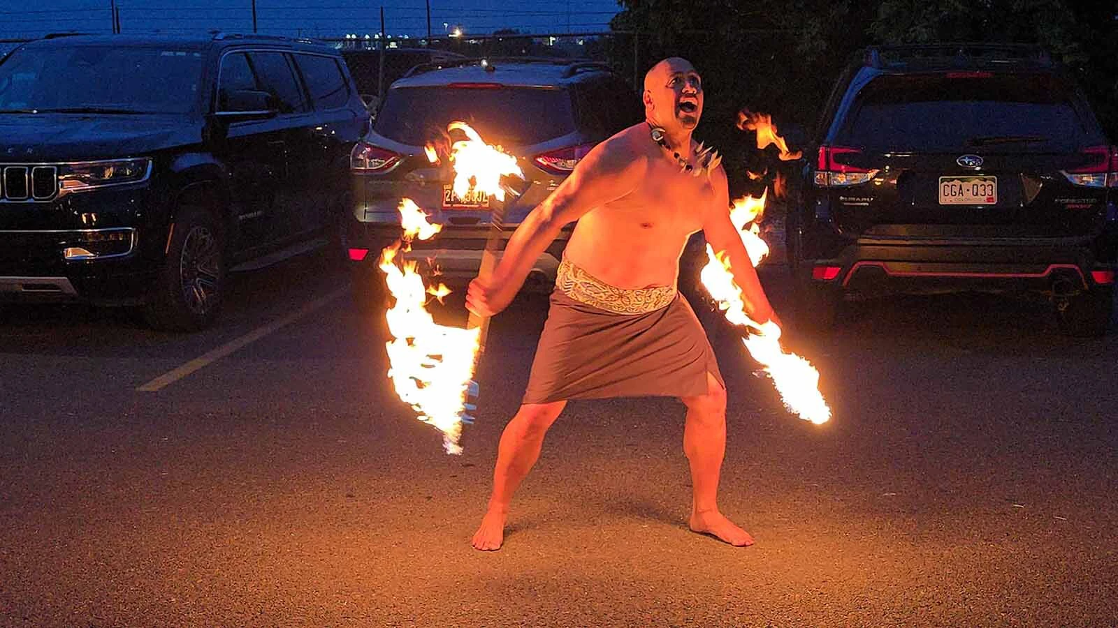 A fire dancer entertains in the parking lot of Railspur during Cheyenne Frontier Days.