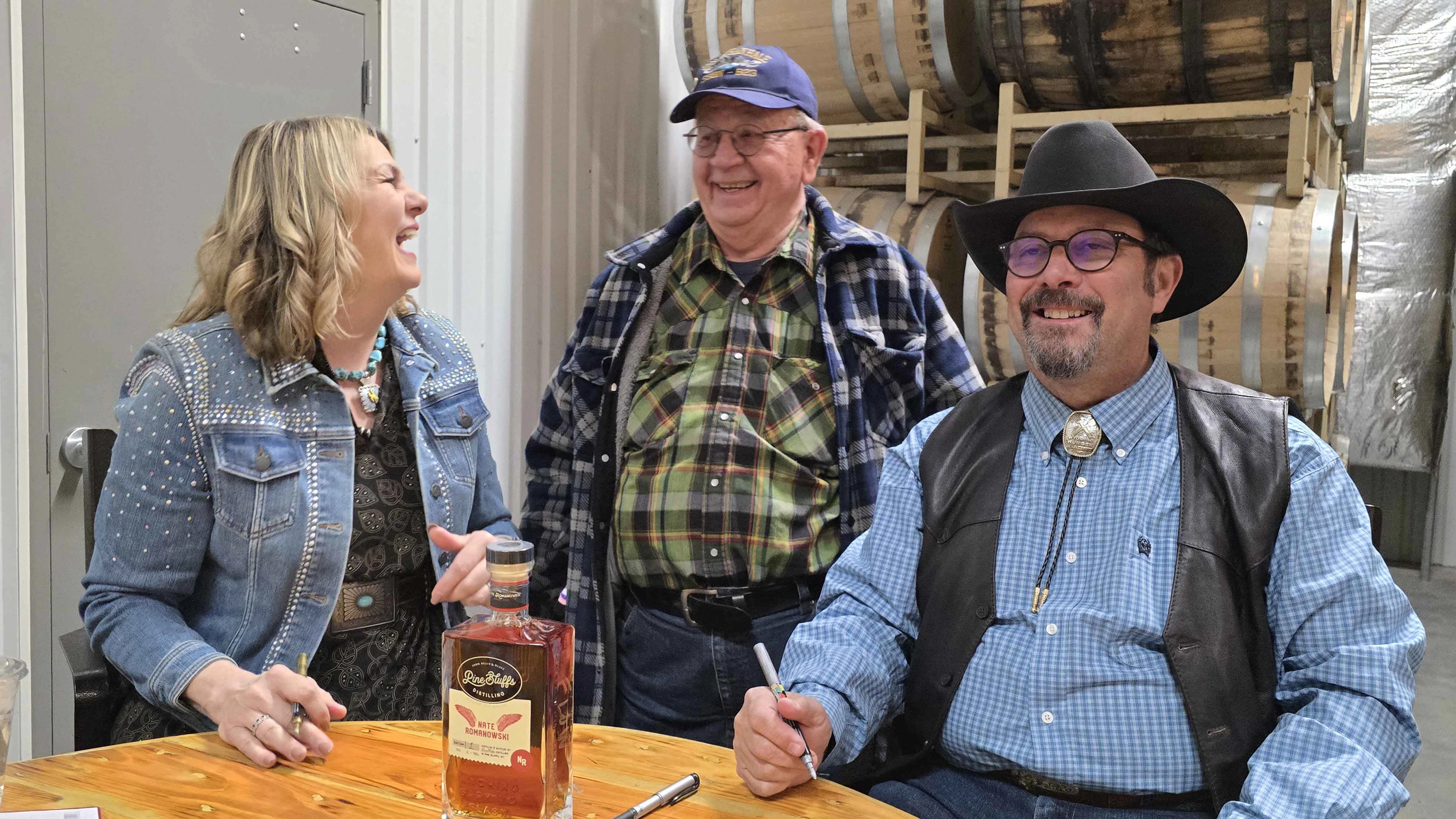 Glen Romig poses with Wyoming's First Lady Jenny Gordon and New York Times bestselling author C.J. Box during the release for Romanowski Rye.