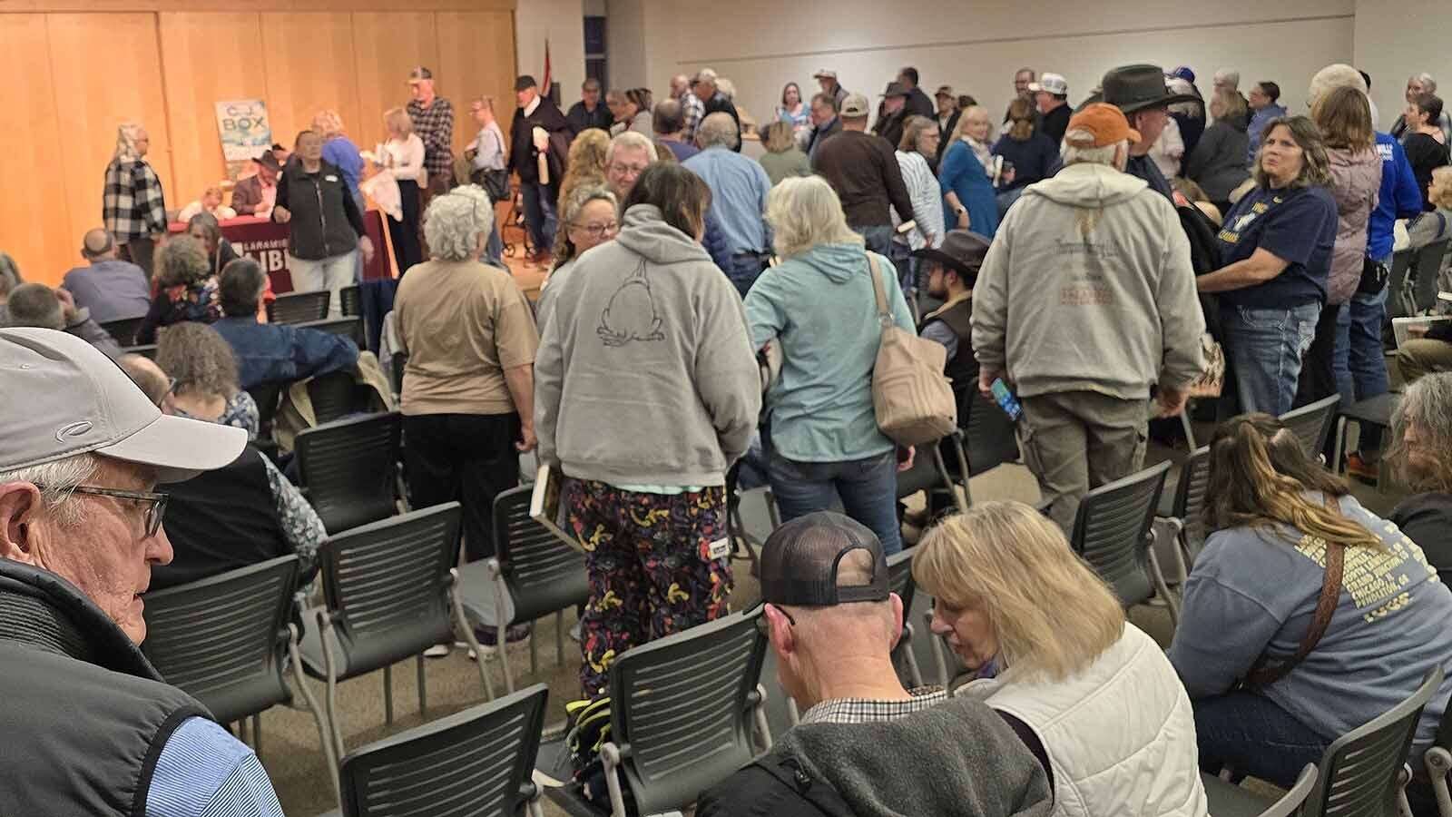 A standing-room-only crowd gathered to get their copies of "The Crossroads" signed in Cheyenne by author C.J. Box. Many in the crowd had more than one book. One superfan from Nebraska, though, had 30 books in all for Box to sign.