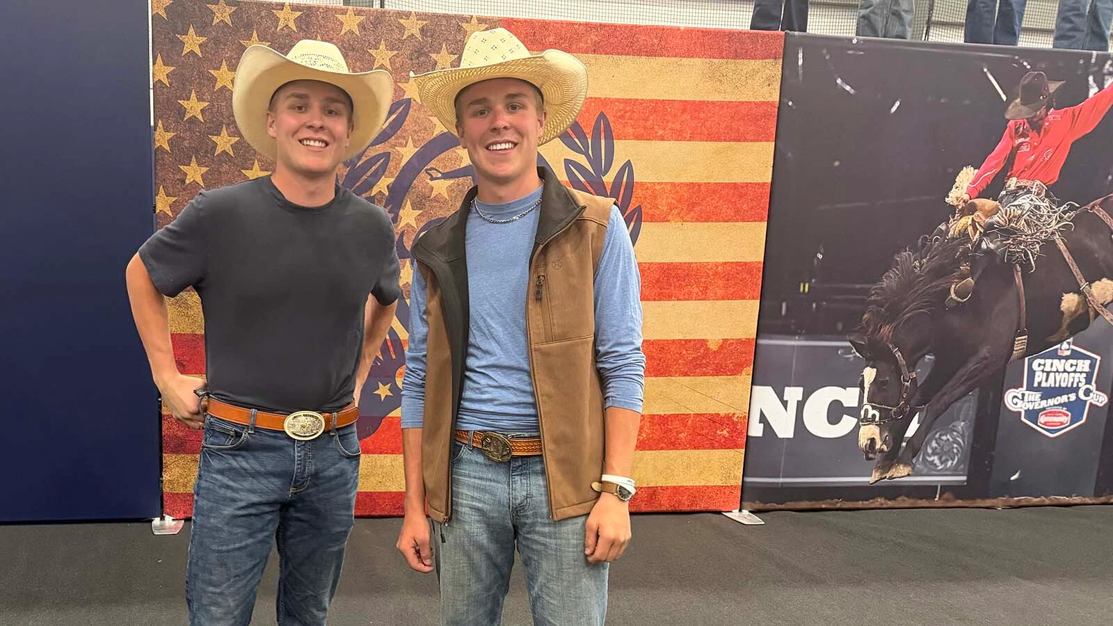 Twins Dax and Brax sporting felt hats, belt buckles and boots pose for a photo during the College National Finals Rodeo in Casper.