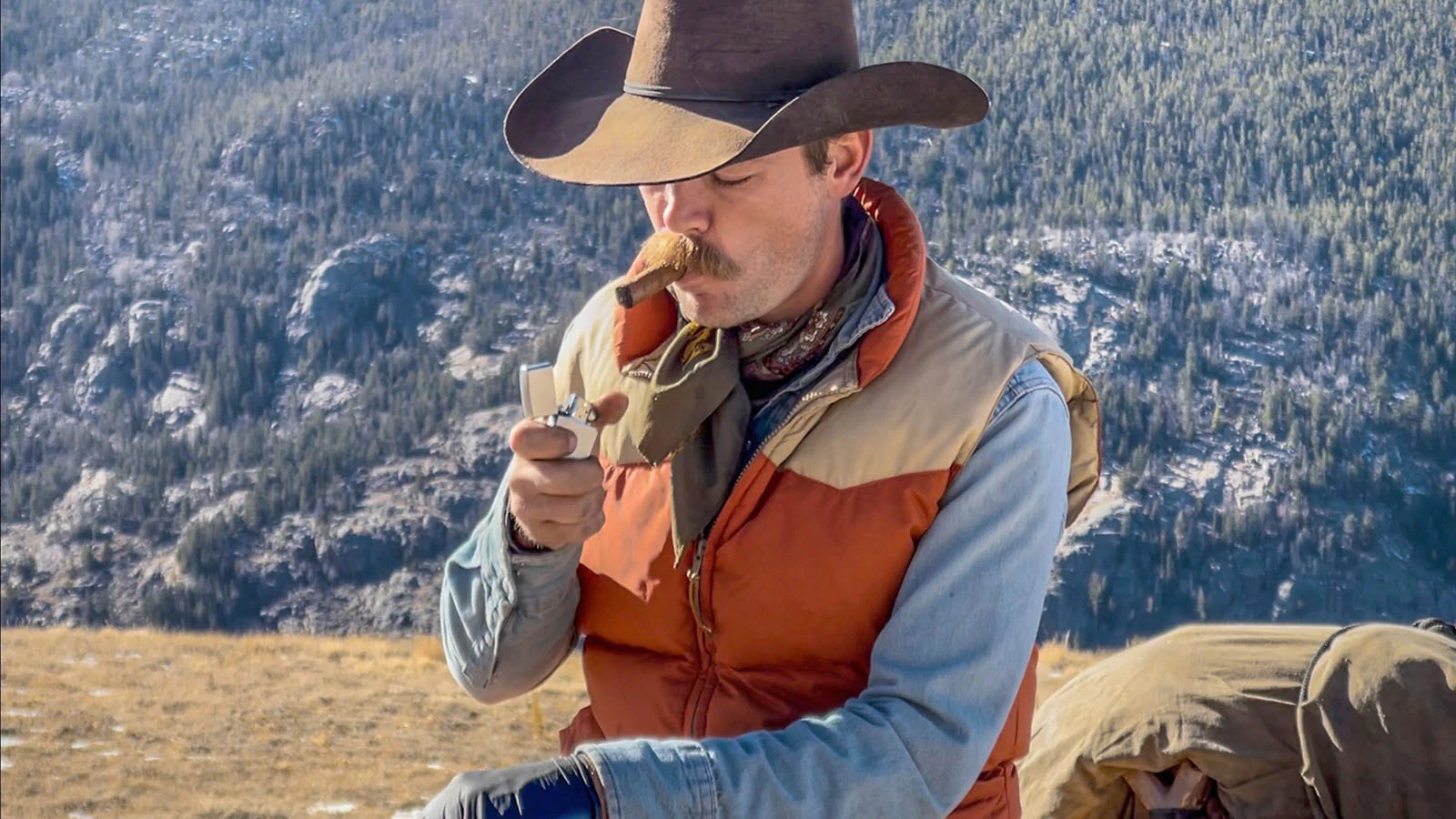 Cade Cole of Dubois traded his modern hunting clothing and gear for denim, flannel, and an iconic 1970s-style down vest for an elk hunt in honor of his grandfather, Clifford Cole, and other hunters of that generation.