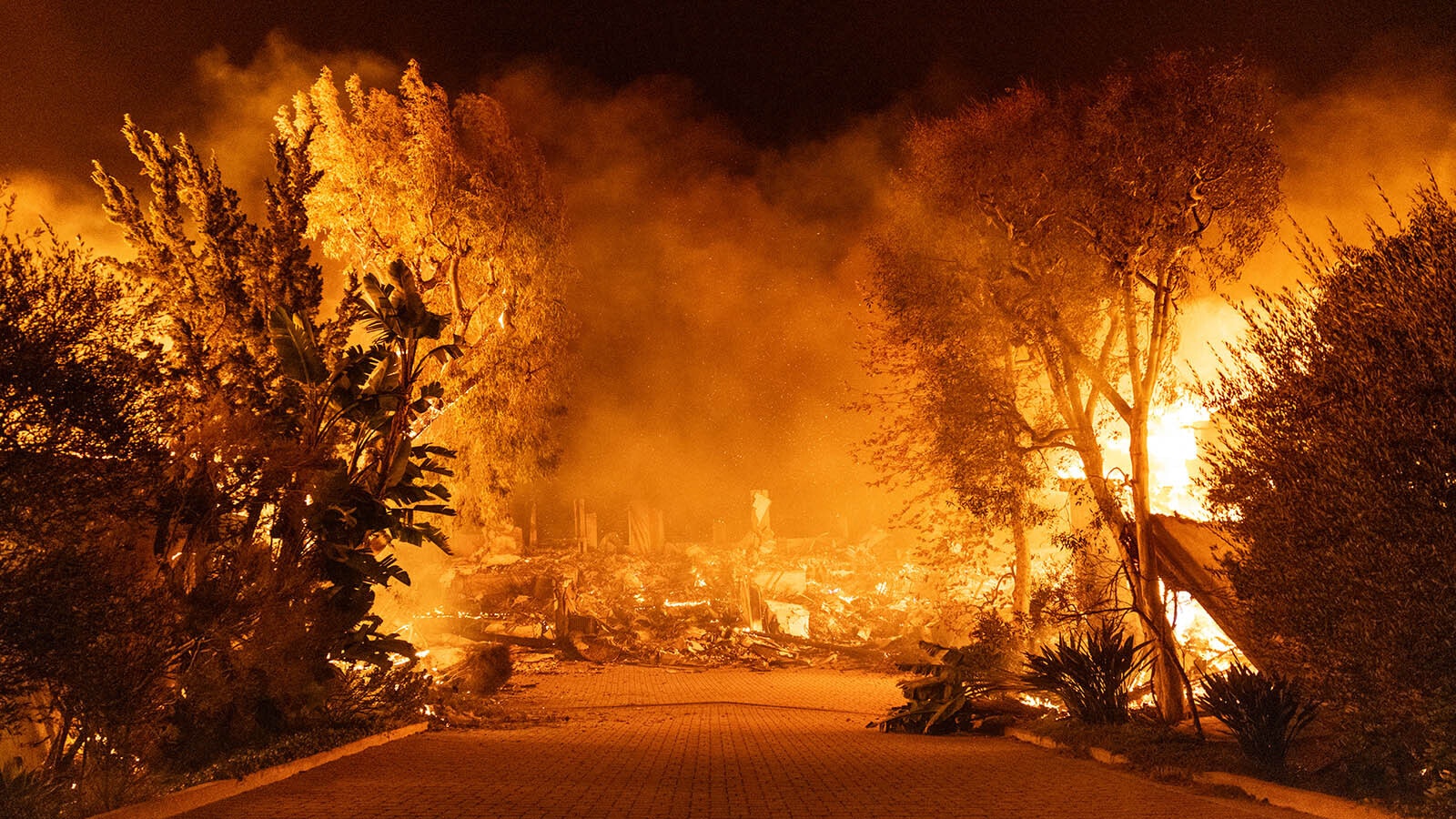 Homes destroyed in the Palisades Fire in the Pacific Palisades community. Multiple wildfires fueled by intense Santa Ana Winds are burning across Los Angeles County.