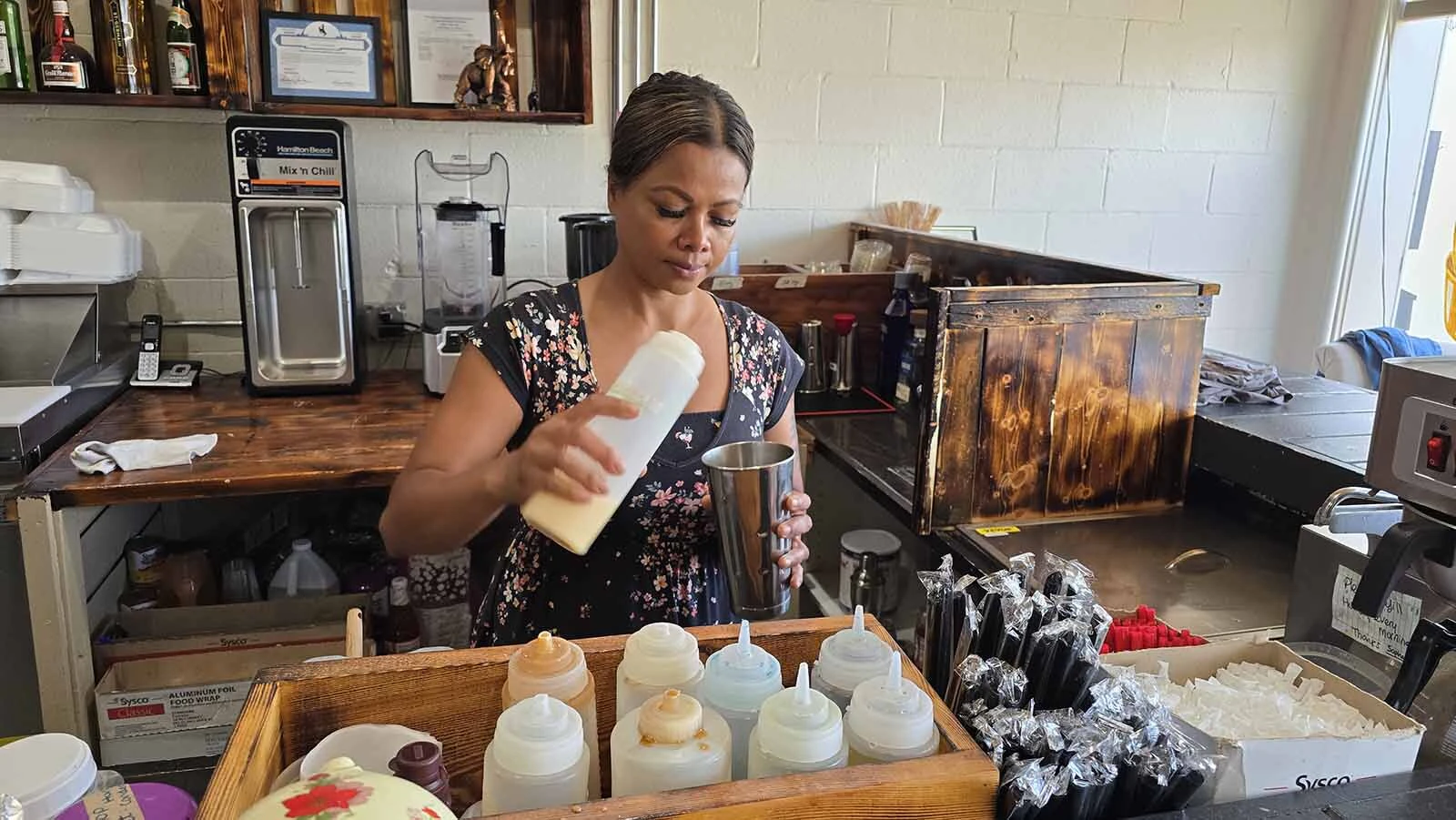 Sophal Thompson makes a Cambodian Coffee at her business, On-Site Laundry in Lander.