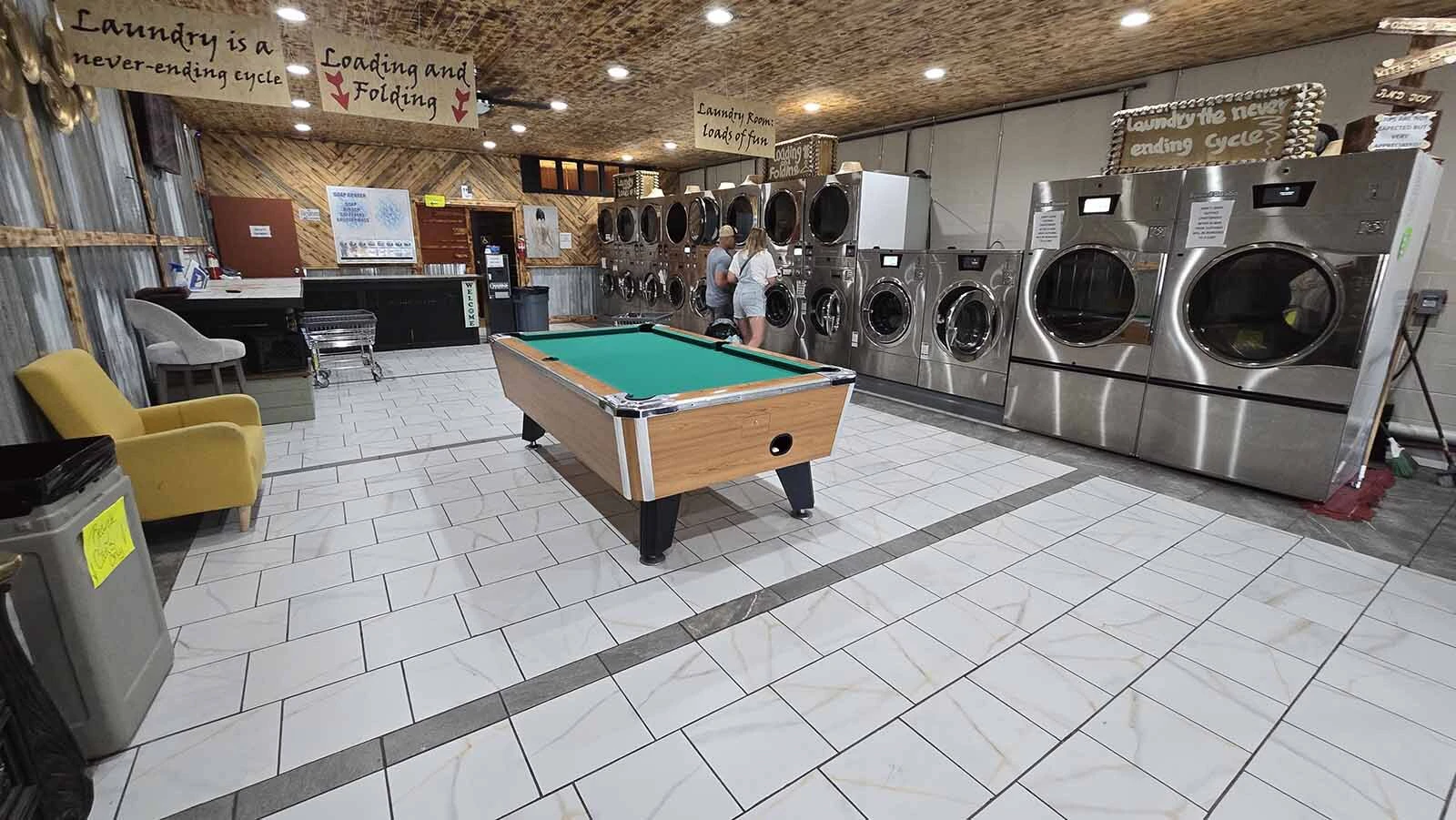 On-Site Laundry includes a pool table for people to play while waiting on laundry to finish.