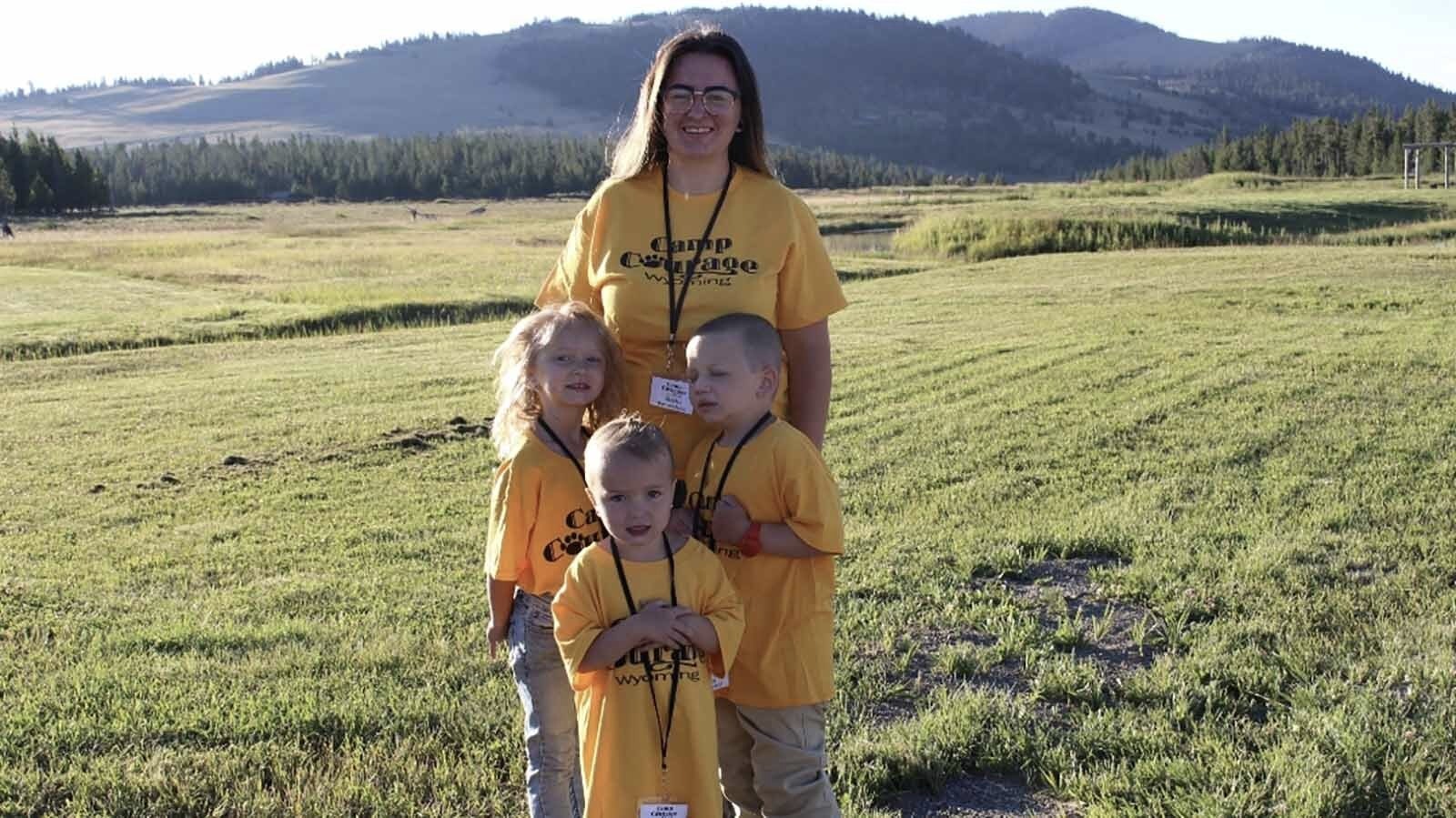 Shantae Smith poses at Camp Courage with her three young children, Mikey, Kinsley and Ella. Mikey was diagnosed with a brain tumor and the family is grateful to be able to just have fun together at camp.