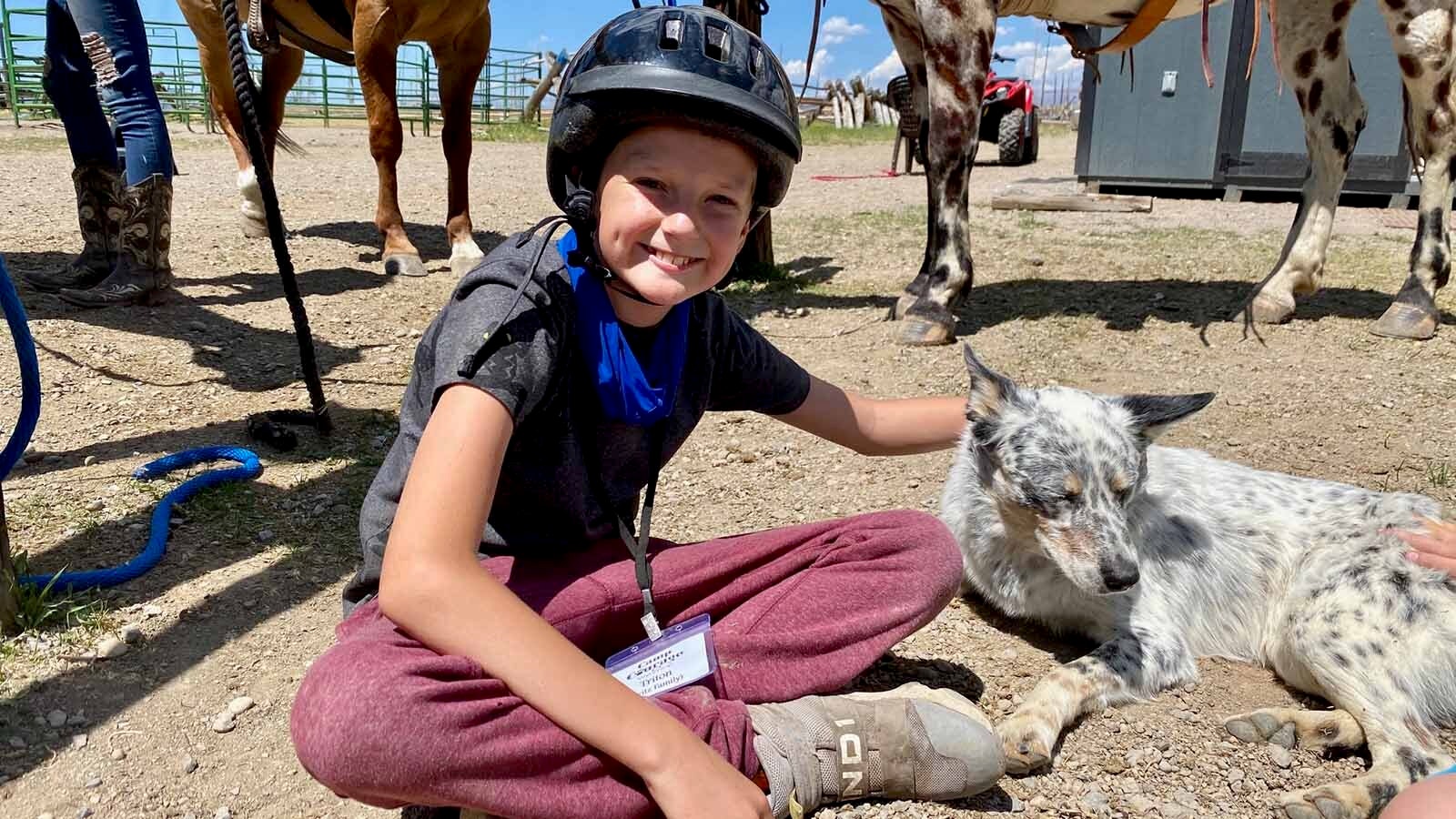 Triton Fritz enjoyed the horse riding and playing with the camp dogs at Camp Courage, a camp devoted to kids like him who are fighting cancer and tumors.