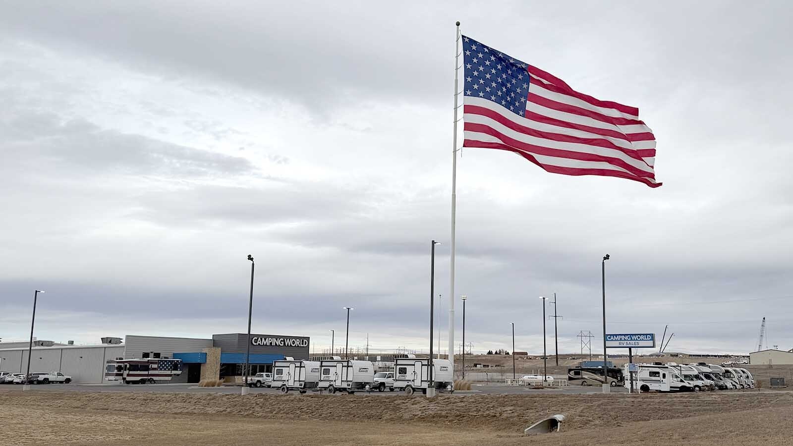 The huge 40-by-80-foot flag at the Cheyenne Camping World makes the store look small in comparison.