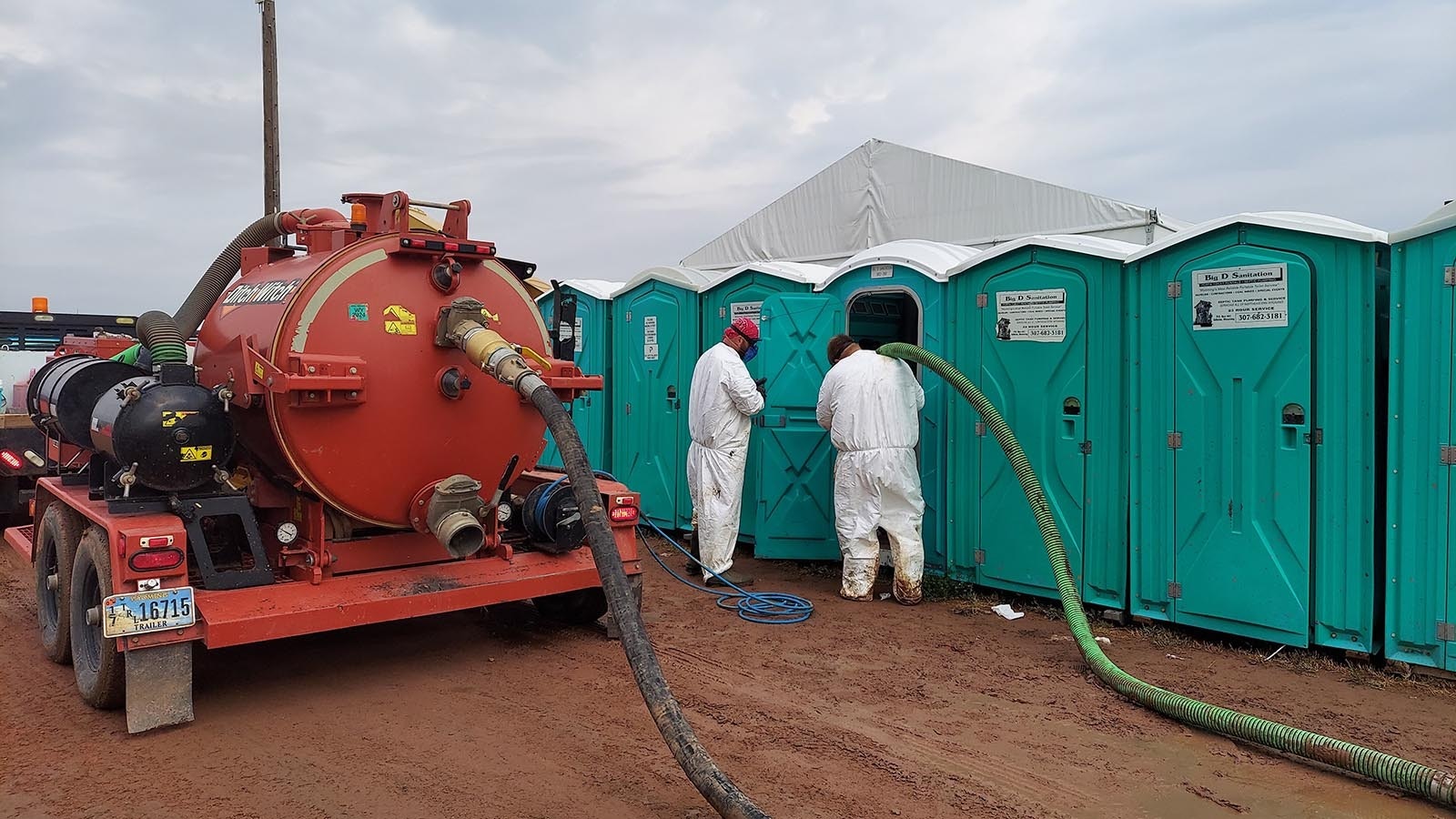 Big D Sanitation workers service on-site porta-potties at the International Pathfinder Camporee in Gillette, Wyoming.