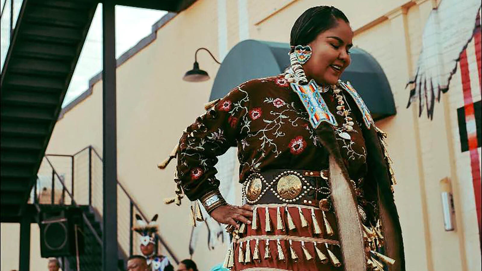 Candace Toledo dances in a jingle dress she created.