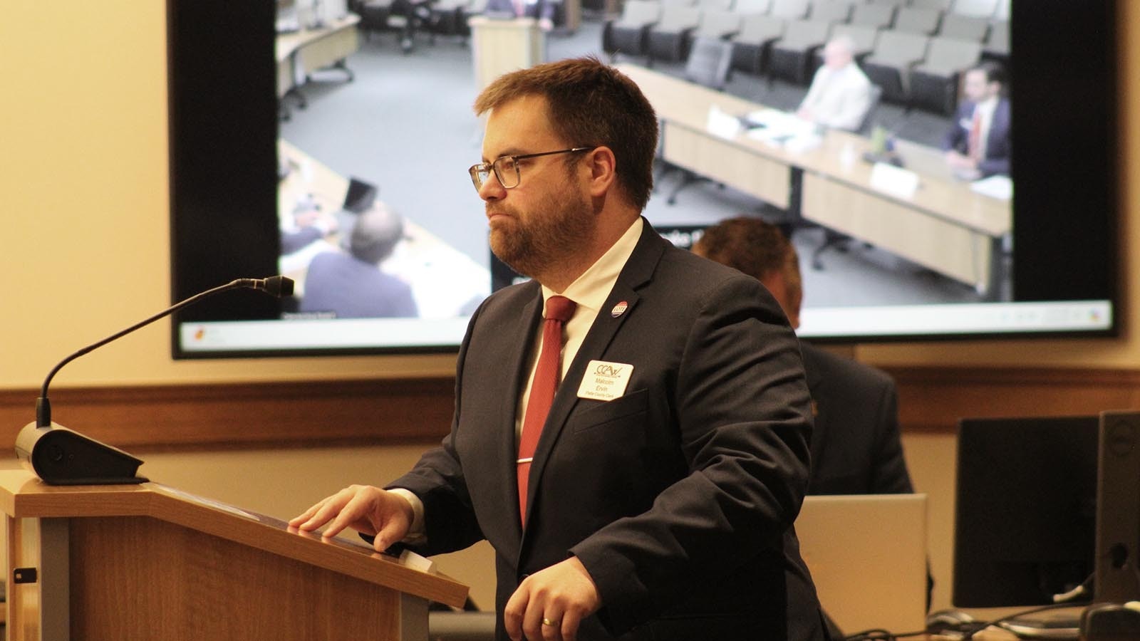 Platte County Clerk and president of the County Clerks' Association of Wyoming Malcolm Ervin speaks during Wednesday's meeting.