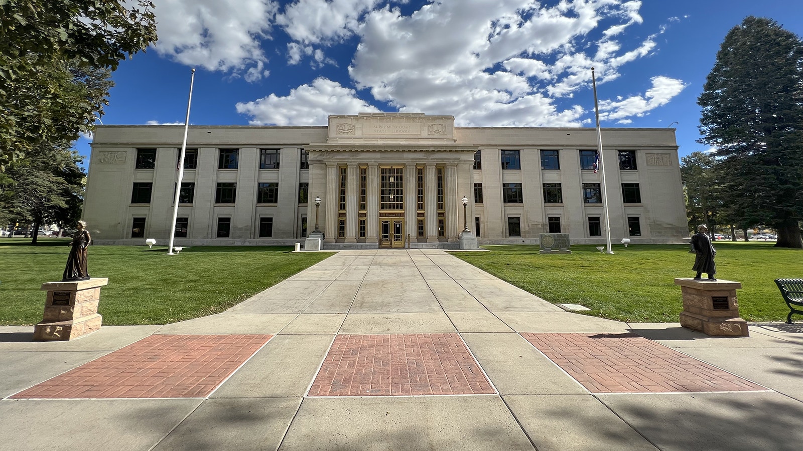 Esther Hobart Morris, left, and Justice Willis Van Devanter in front of Wyoming Supreme Court building.