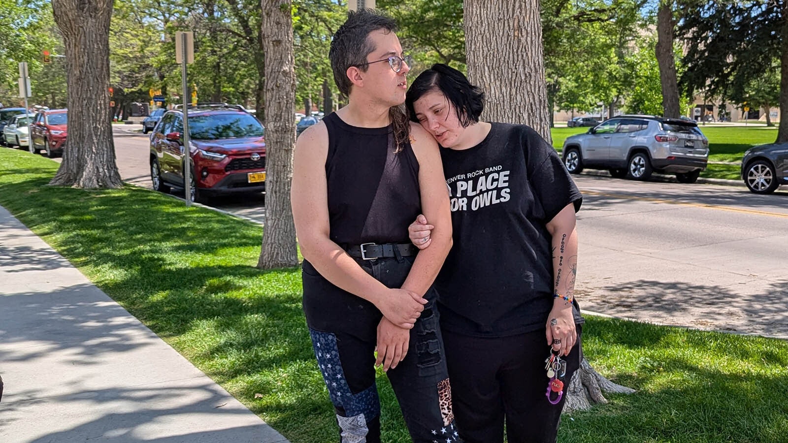 Transgender woman Rihanna Kelver, left, and financee Kylara Little, embrace before Kelver entered the Wyoming State Capitol Tuesday to violate the newly implemented Wyoming law restricting public building restroom users to the restroom of their birth sex.