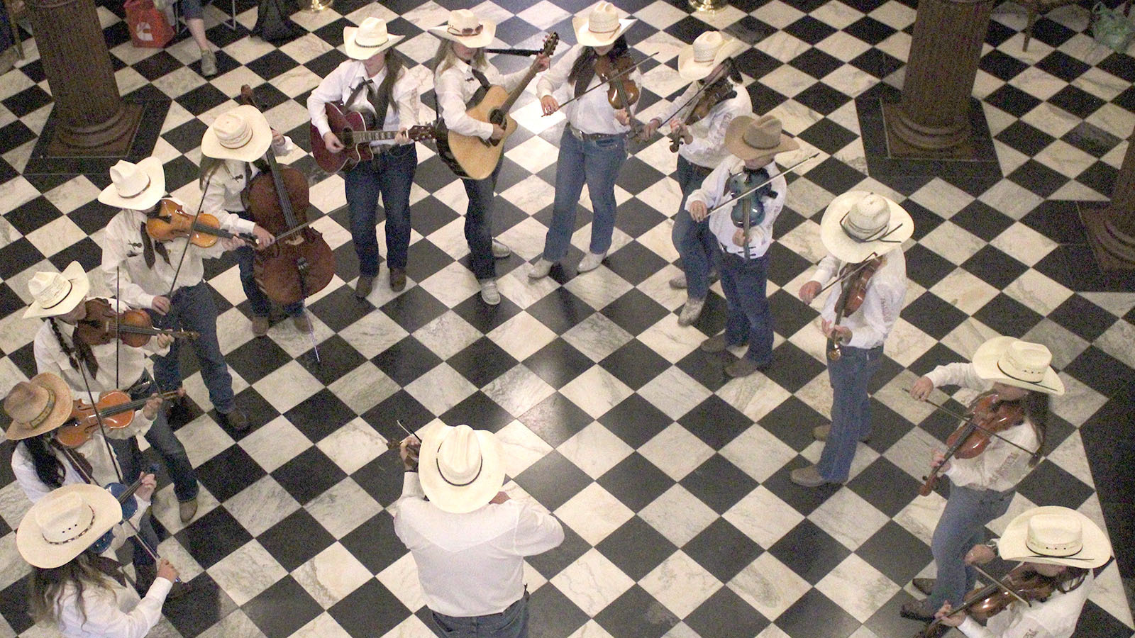 Young musicians with the Cheyenne Fiddle Orchestra perform in the Wyoming Capitol Rotunda on Saturday.