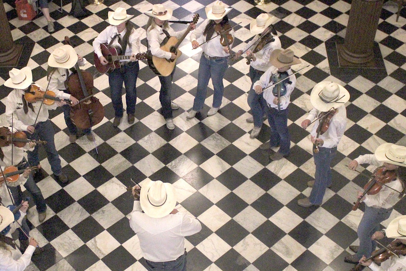 Young musicians with the Cheyenne Fiddle Orchestra perform in the Wyoming Capitol Rotunda on Saturday.