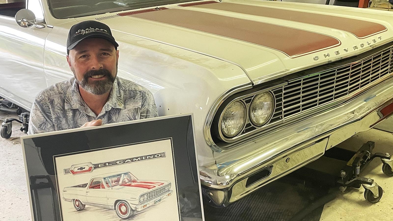 Shannon Watts poses with his first drawing that started the artist ride of a lifetime. His ‘64 El Camino will have to wait for the paint job and full restoration as Watts pursues his art.