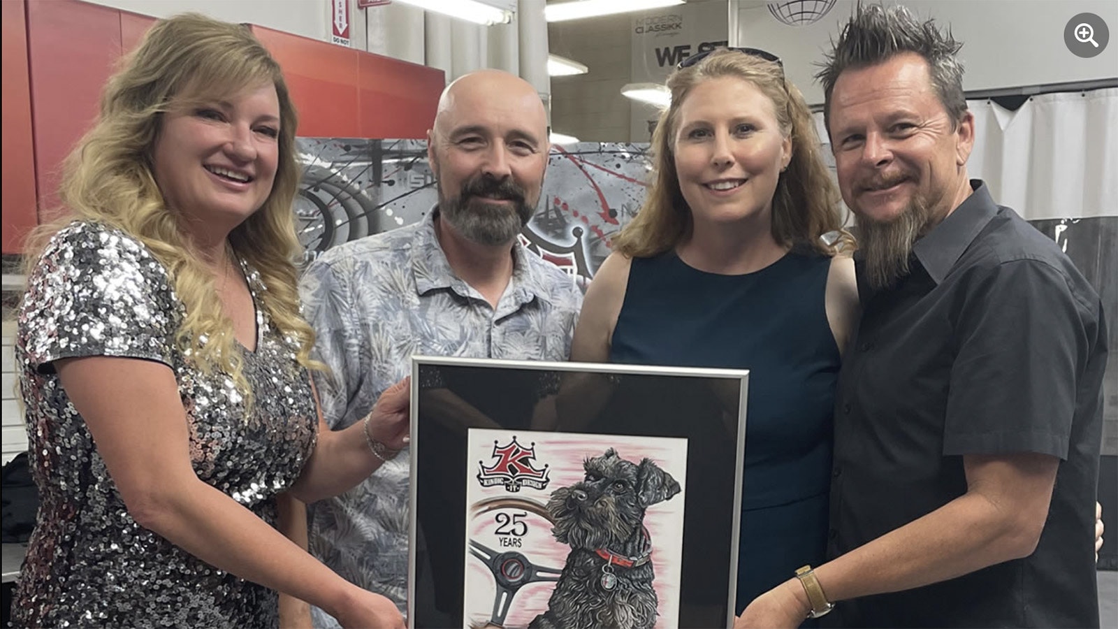 Dave Kendig is presented with a customized illustration. Pictured Charity Kendig, Shannon Watts, Julie Watts, Dave Kendig.