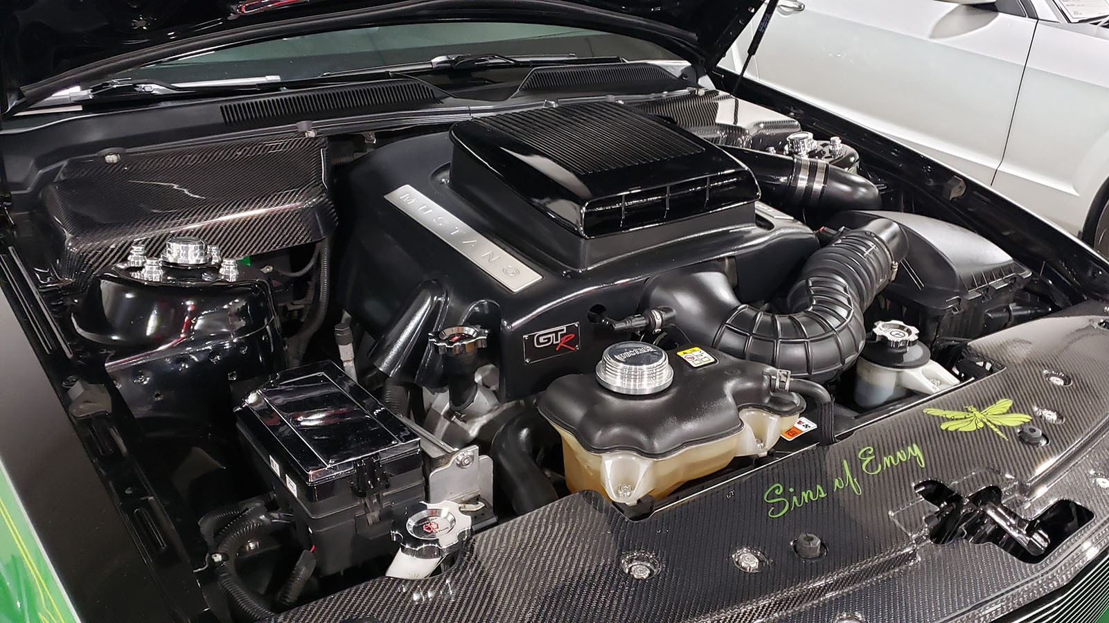 A look under the hood of a green Mustang called Sins of Envy.