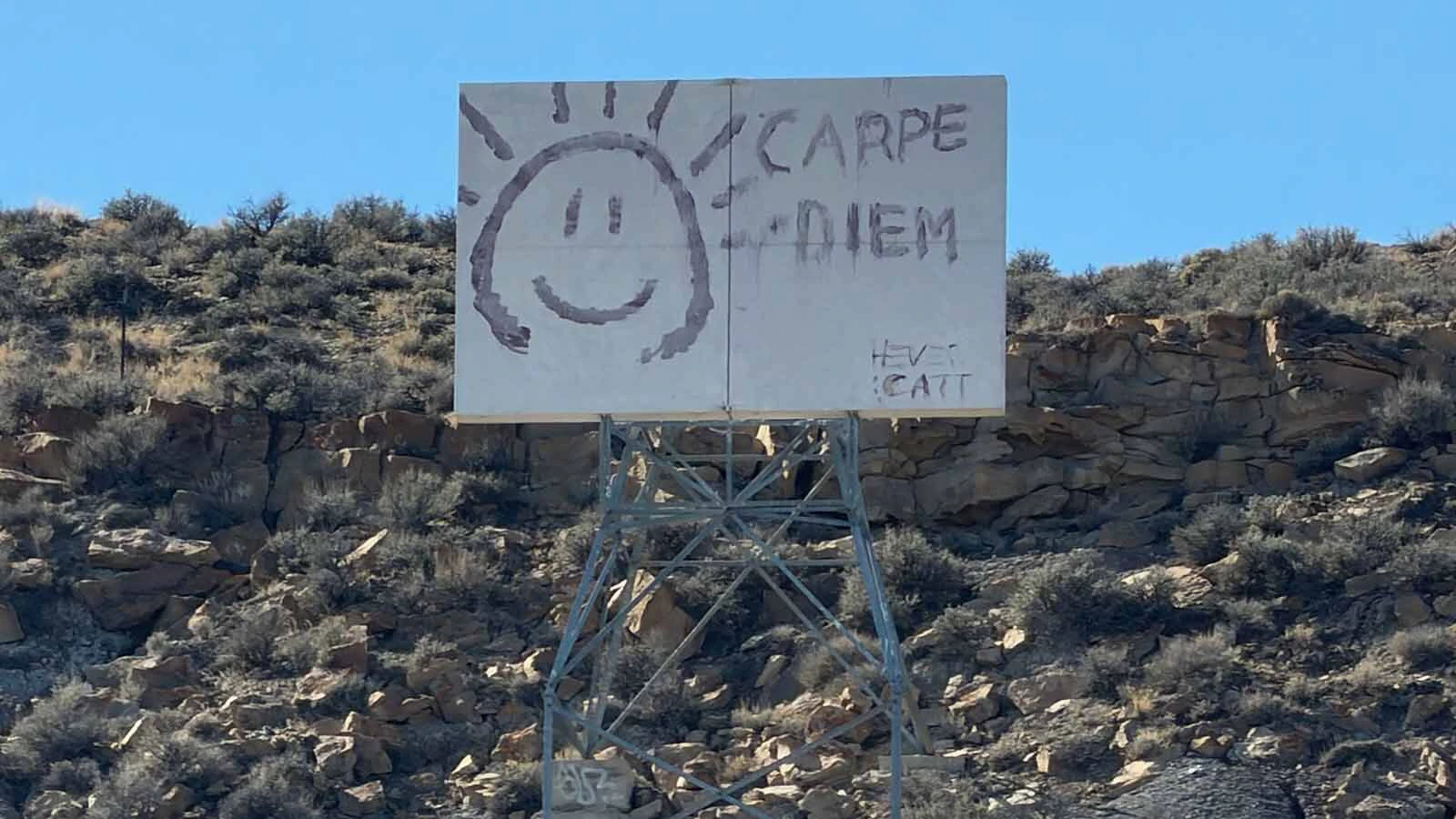 A Rock Springs man's curiosity about decades-old graffiti of "Carpe Diem" on a hillside sign revived memories of an 18-year-old who fell to her death nearby in 1979.