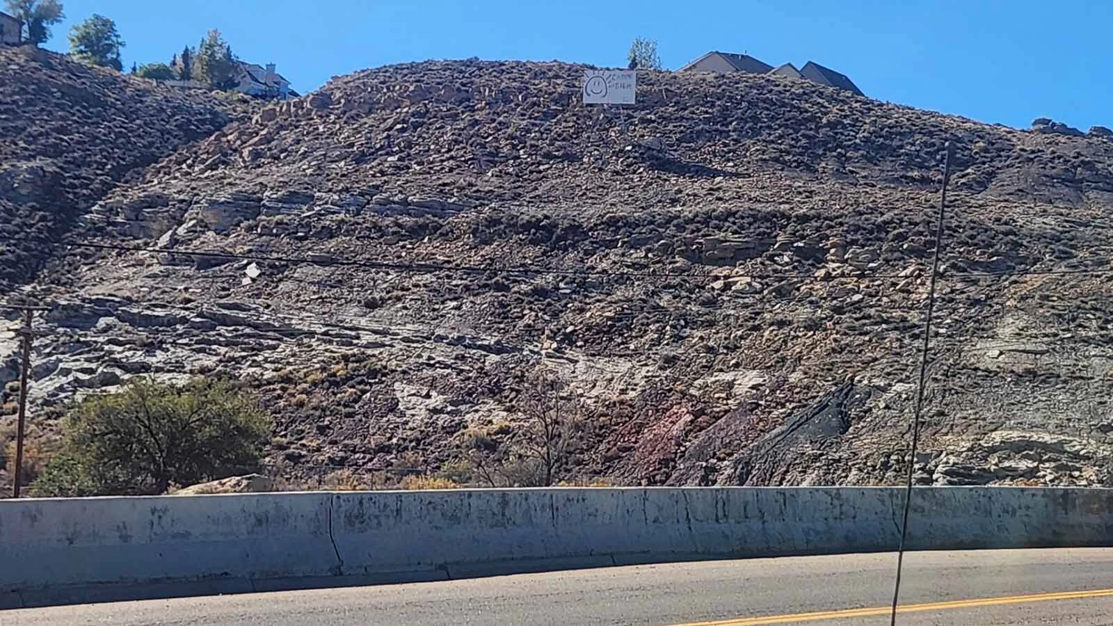 A Rock Springs man's curiosity about decades-old graffiti of "Carpe Diem" on a hillside sign revived memories of an 18-year-old who fell to her death nearby in 1979.