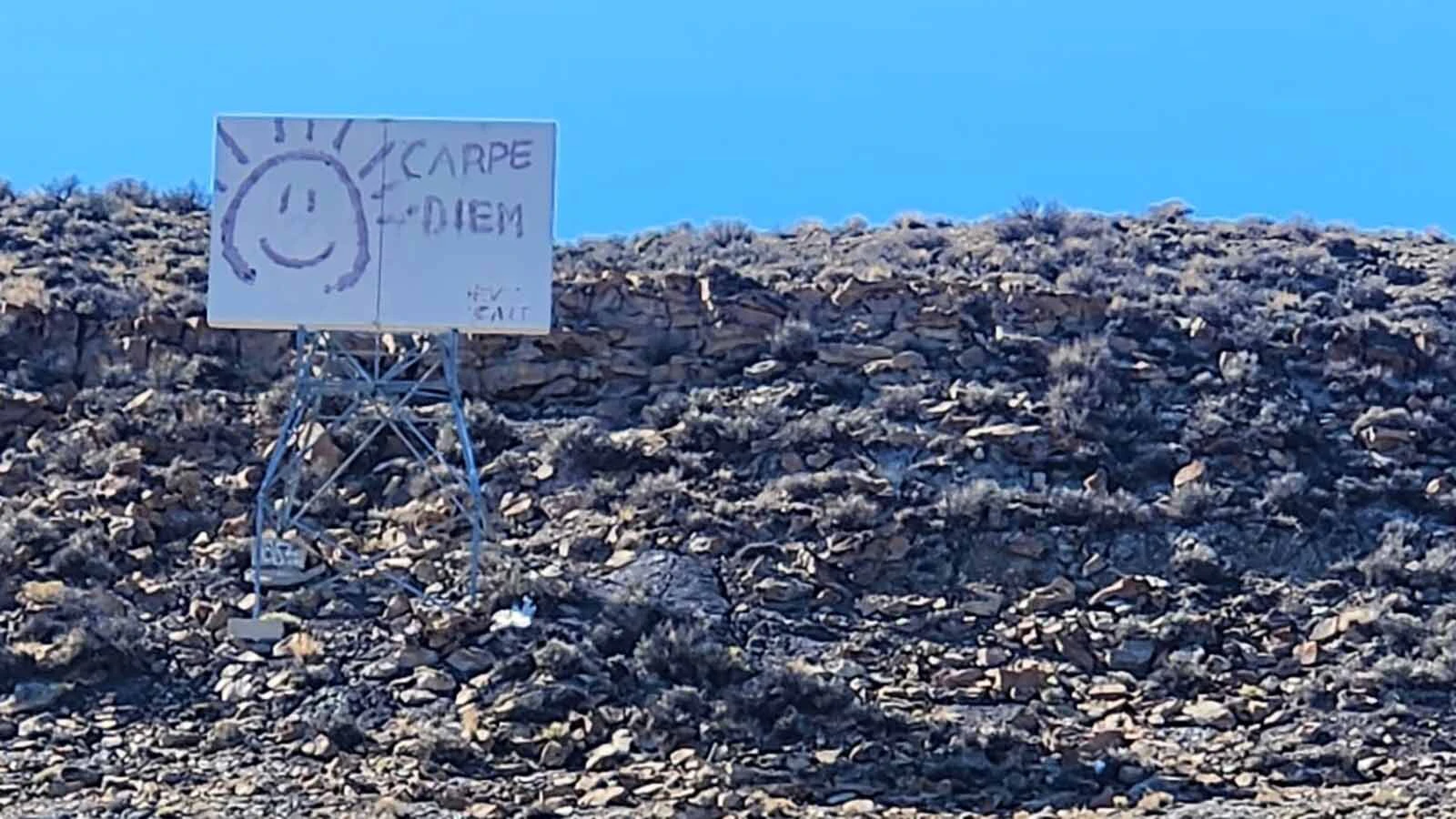 A Rock Springs man's curiosity about decades-old graffiti of "Carpe Diem" on a hillside sign revived memories of an 18-year-old who fell to her death nearby in 1979.