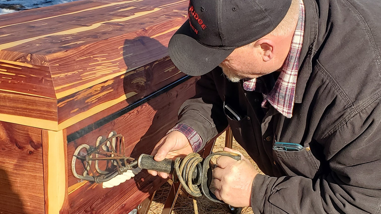 A growing trend in Western funerals is for family and loved ones to put hot cattle brands to wooden caskets. It’s the most cowboy way for ranching families and others in the West to say goodbye.