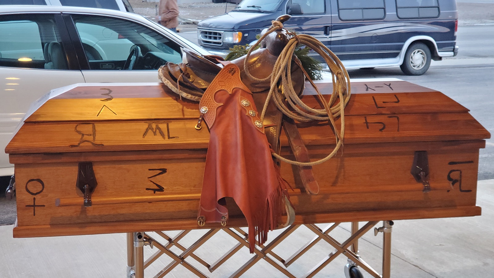 A growing trend in Western funerals is for family and loved ones to put hot cattle brands to wooden caskets. It’s the most cowboy way for ranching families and others in the West to say goodbye.