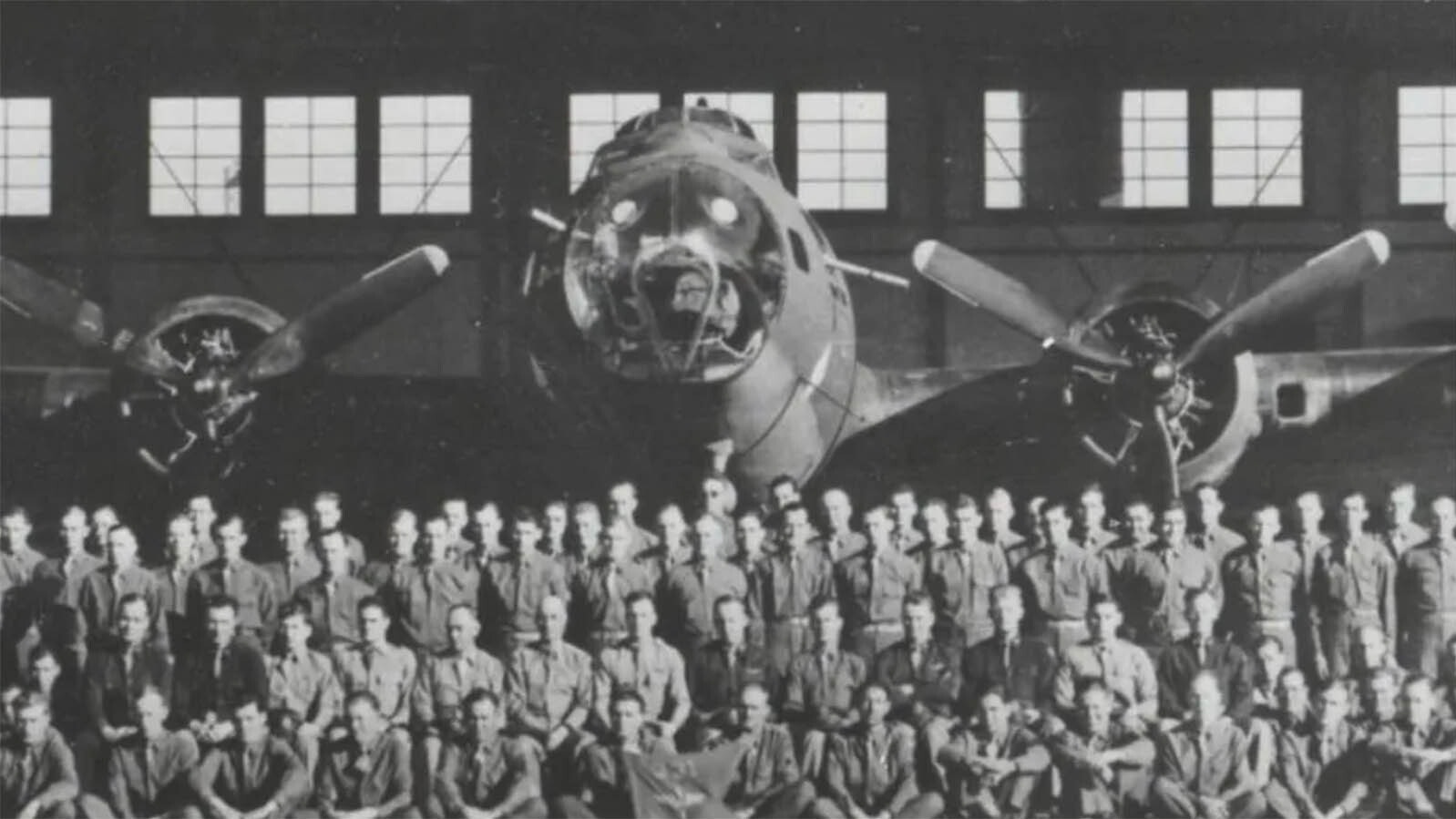 A photo of flight crews outside a hangar at Casper Army Air Base.