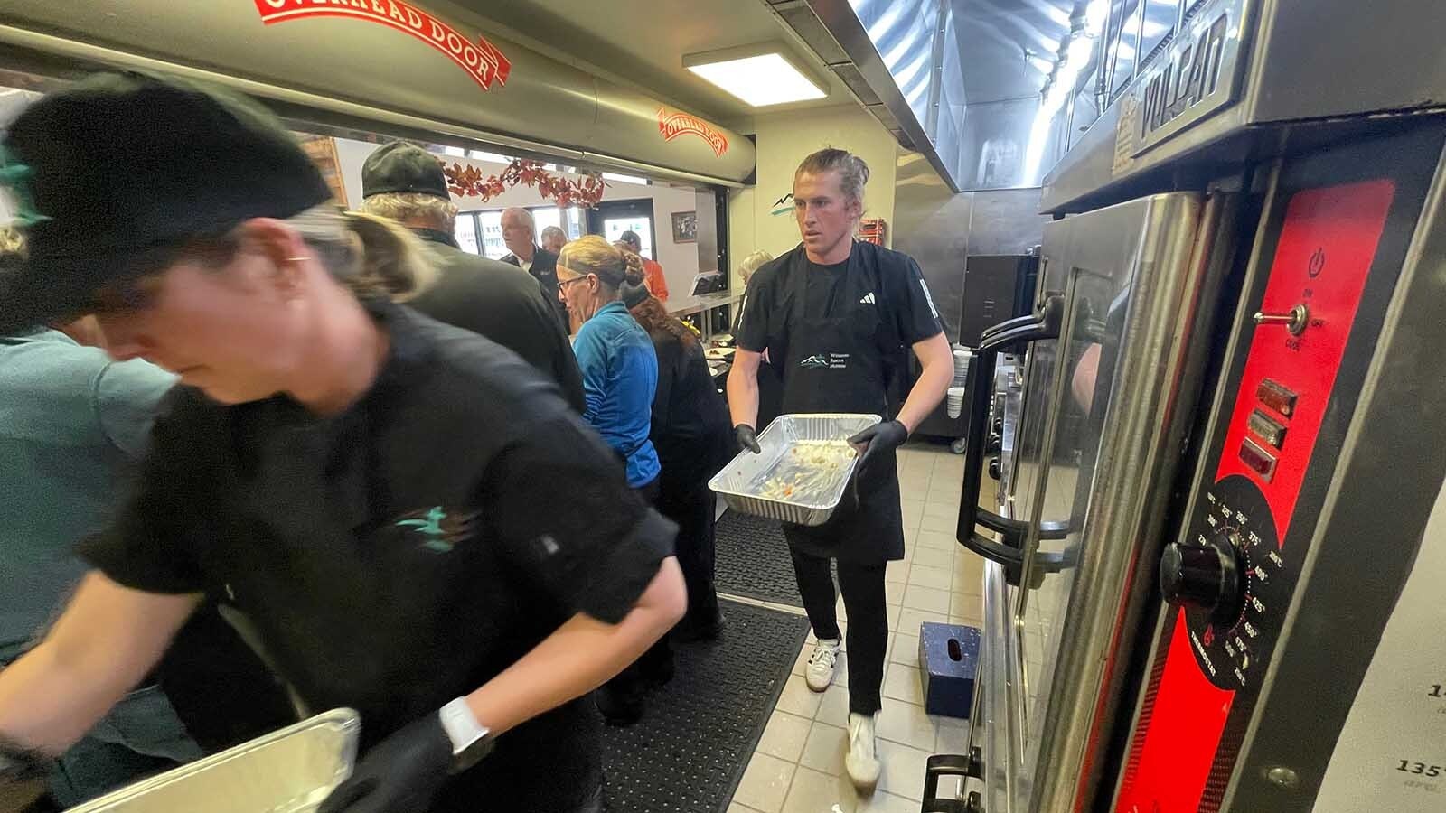 A small army of volunteers work the kitchen and keep plates full at the Wyoming Rescue Mission in Casper.