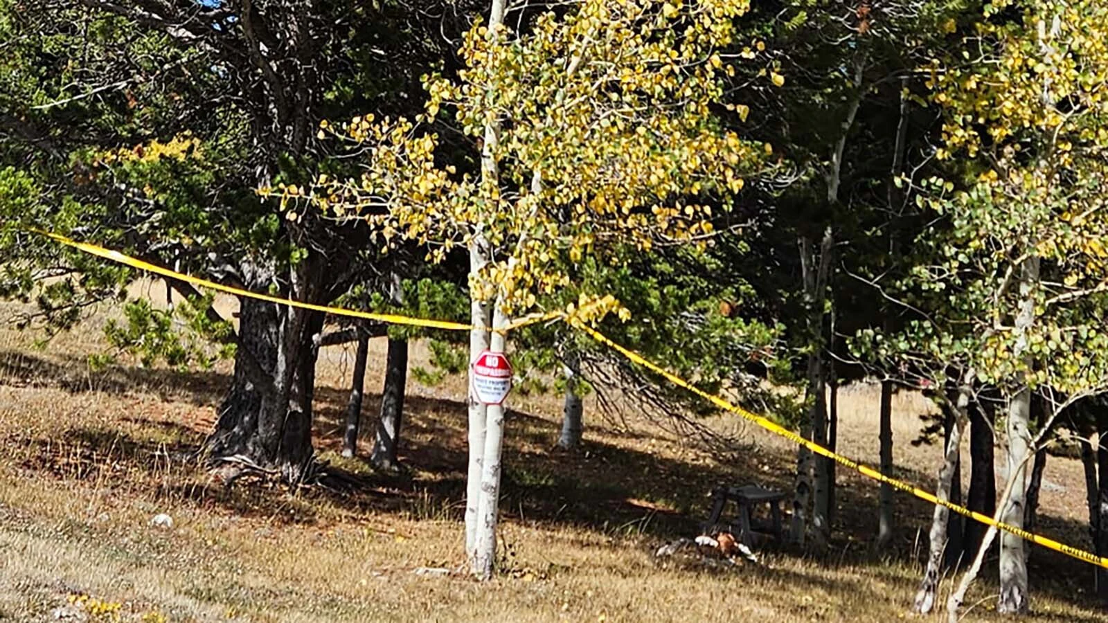 Lisa Evers has put yellow caution tape around her property, including the tree where her father's ashes are buried, to prevent Rocky Mountain Power from fire mitigation work.