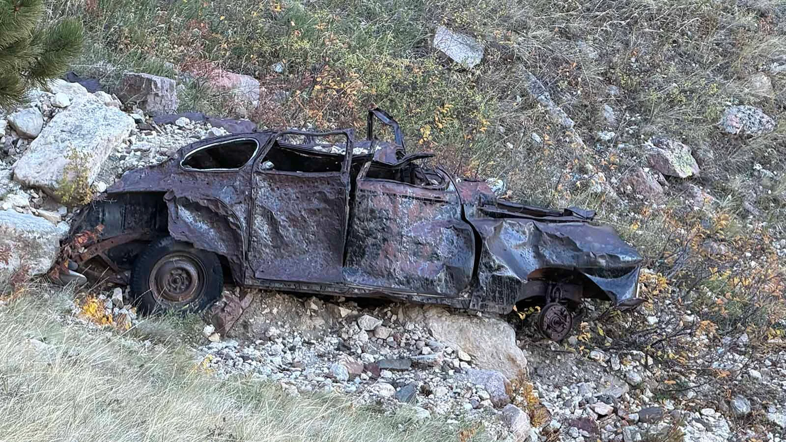 The battered remains of an old car sit below the Bridle Trail on Casper Mountain, where the wreck has been a familiar landmark to generations of hikers and horseback riders. Exactly when and how it got there remains a mystery.