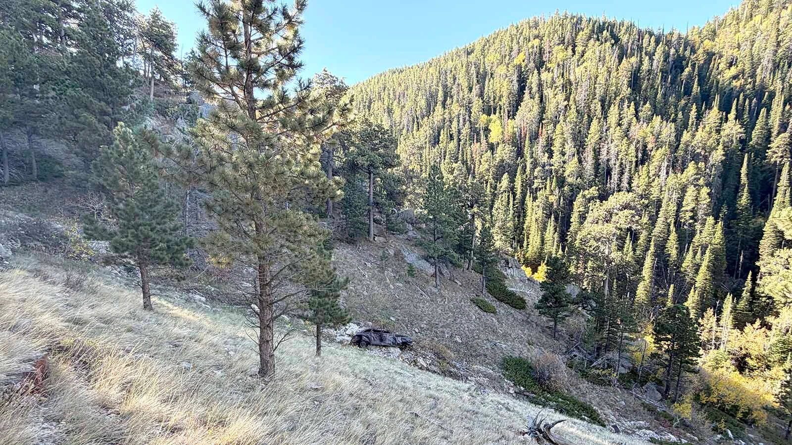 The battered remains of an old car sit below the Bridle Trail on Casper Mountain, where the wreck has been a familiar landmark to generations of hikers and horseback riders. Exactly when and how it got there remains a mystery.