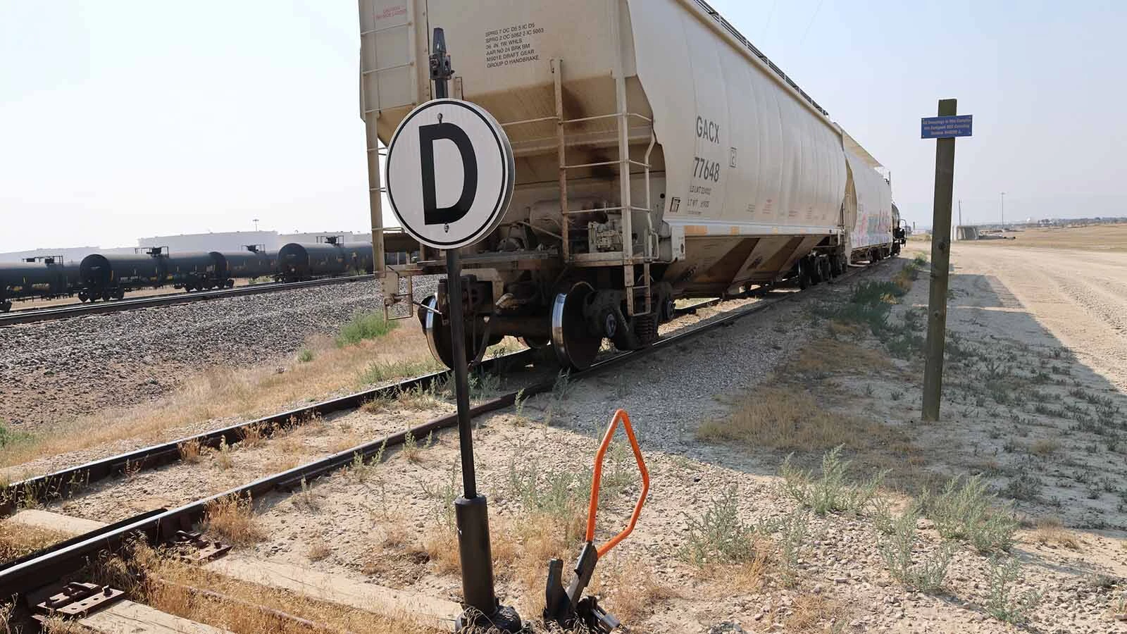 Cars sit on a track designated for drop-off to the rail yard from BNSF.