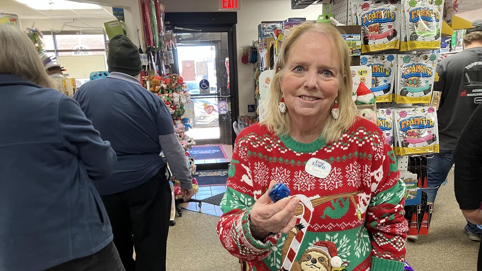 Toy Town owner Dalene Lockhart said one of the hot sellers this year is a heavy spinning cube that she holds in her hand.