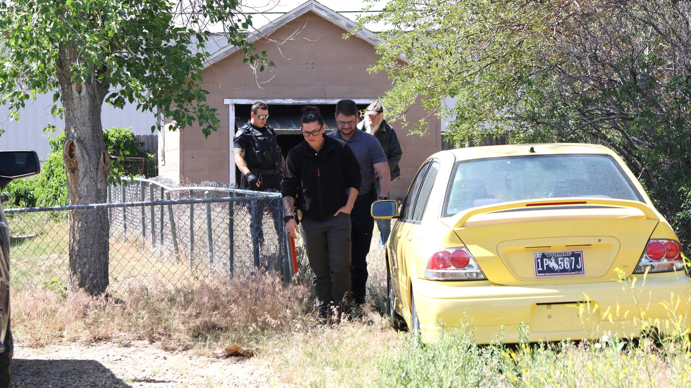 Casper Police escort a man identified as the homeowner’s father off the property where he lived on Monday morning.