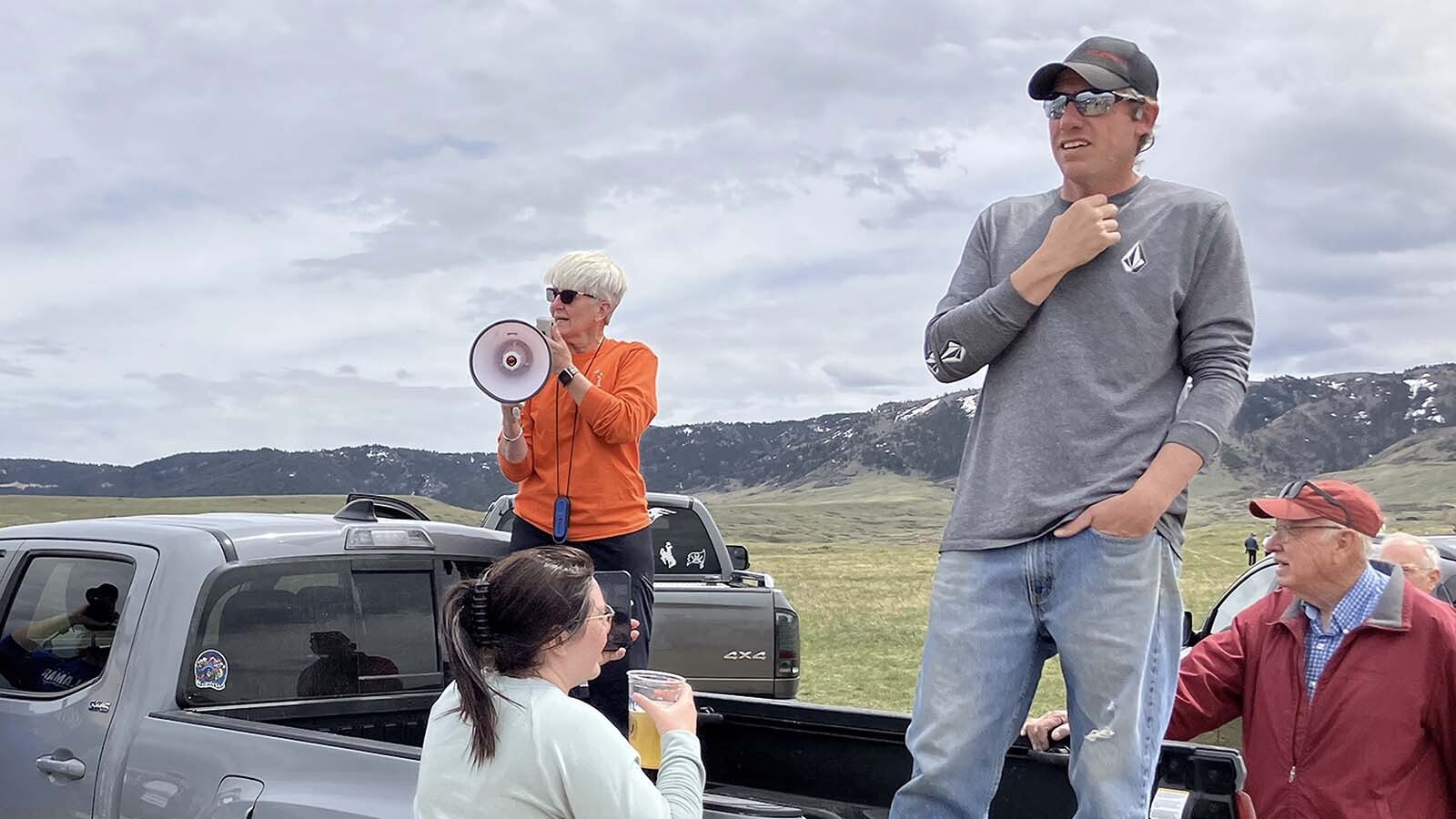 Casper Mountain Preservation Alliance Chairperson Carolyn Griffith, with megaphone, talks with Casper Mountain supporters opposed to gravel mining during a hike on the state school section last year.