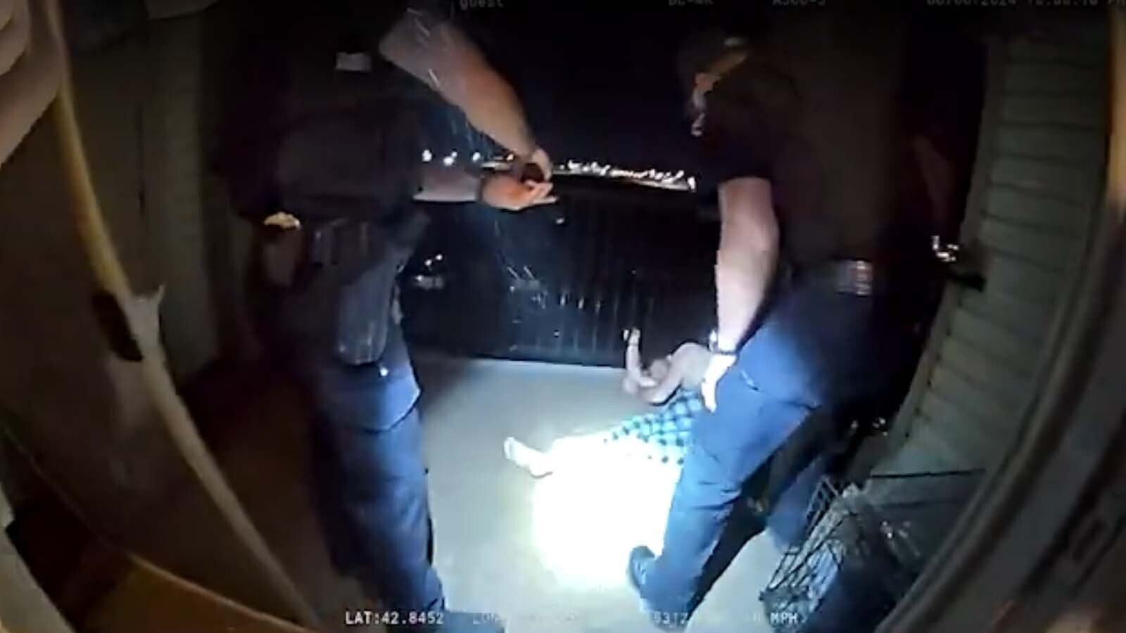 This image from body cam video released by the Casper Police Department shows the moments right after an officer fired seven shots at suspect Trae Spurlock, hitting him six times. Spurlock's face has been intentionally blurred.