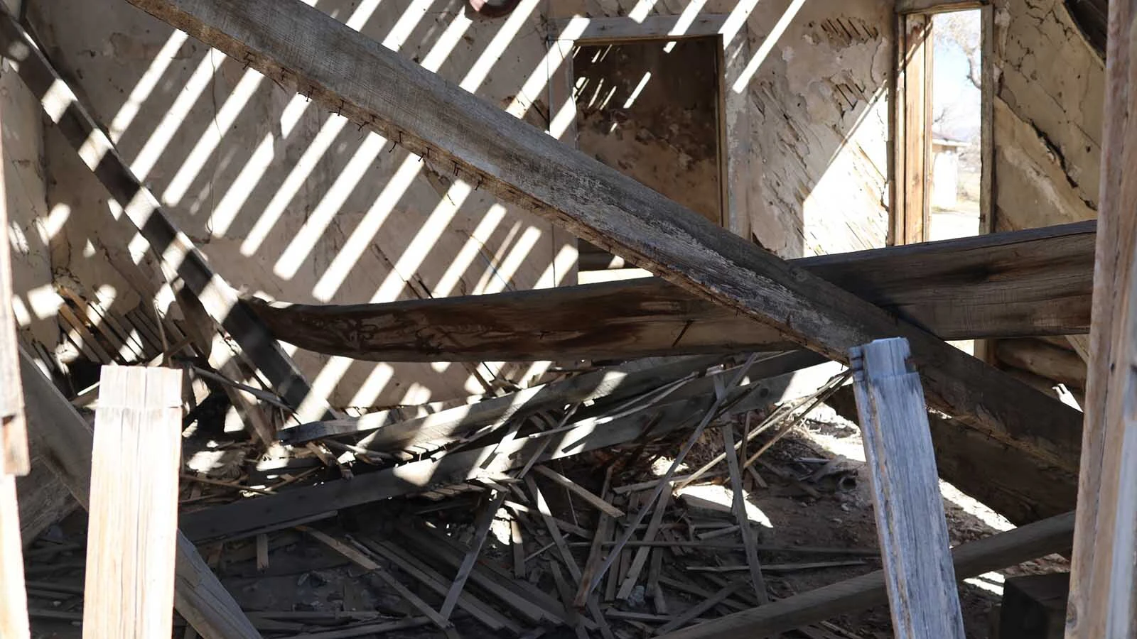 Inside the cabin the wood is falling the ceiling and from the walls.