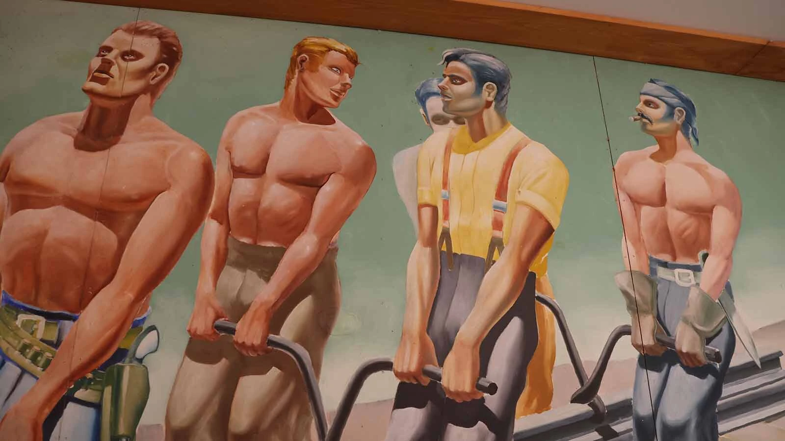 A mural showing a railroad crew laying track across the state is one of 15 preserved at the museum.