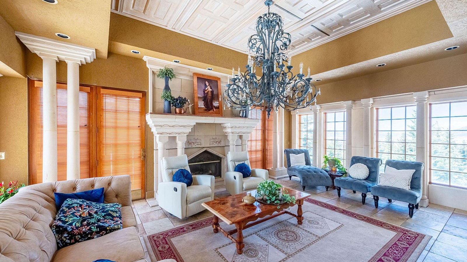 The living room features vaulted ceilings and lots of winders to let in natural light.
