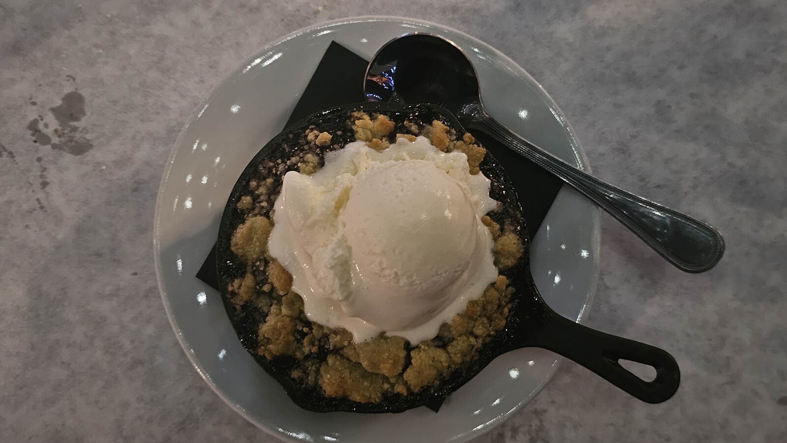 Desserts were free the last night  at Cavalryman Steakhouse in Laramie. This was a berry crumble topped with ice cream, served in piping hot cast-iron skillet.