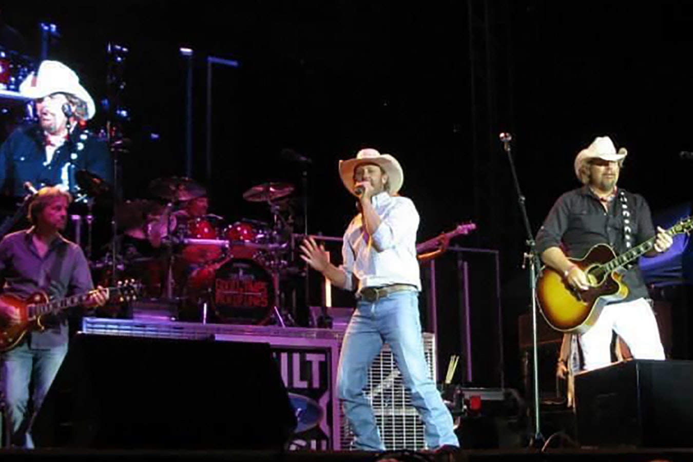 Country music stars Chancey Williams, left, and Toby Keith perform Keith's smash hit "Should've Been a Cowboy" at Cheyenne Frontier Days.