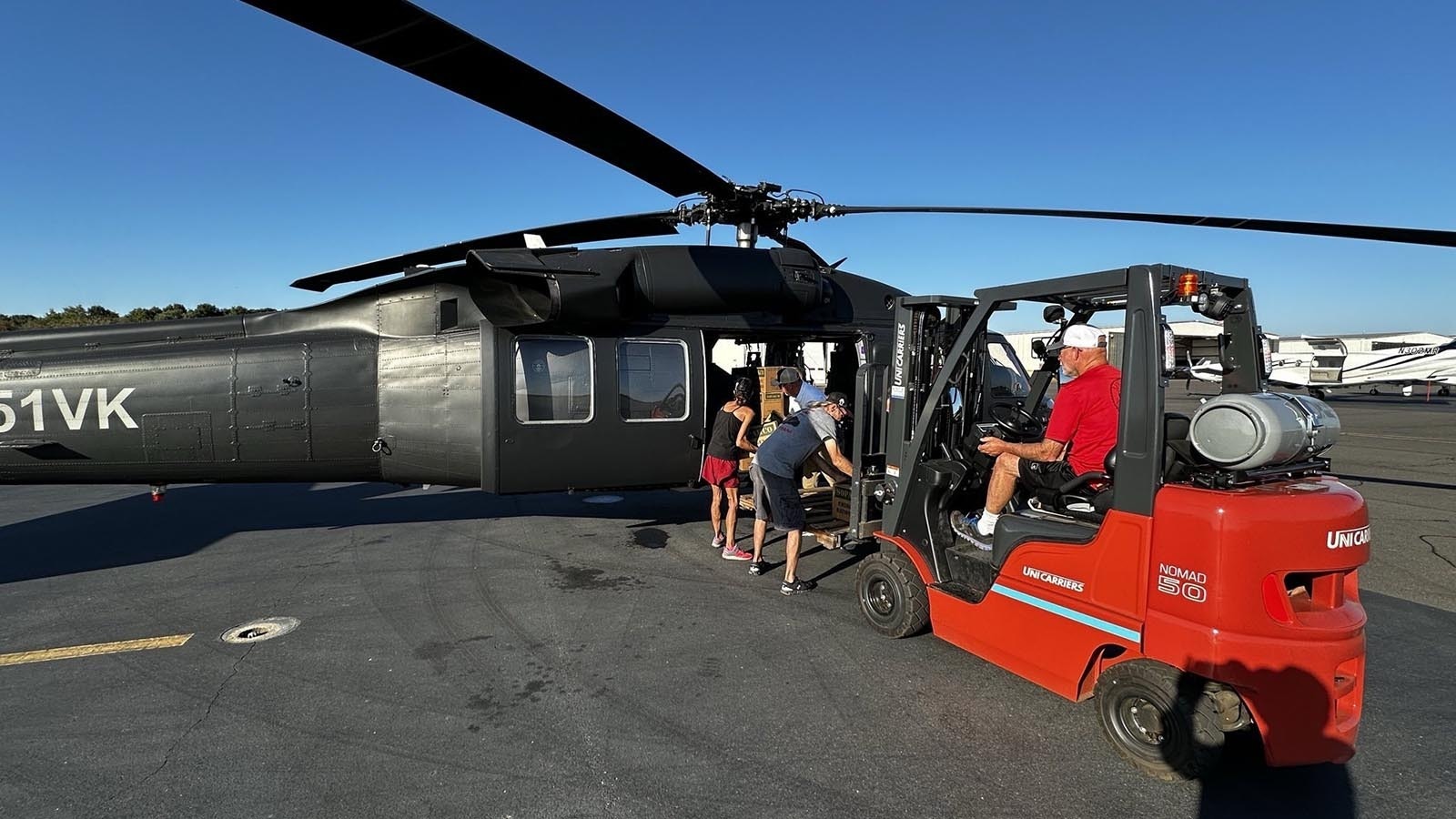 The crew delivered 16 tons of emergency goods in Charles Hoskinson's Black Hawk helicopter.