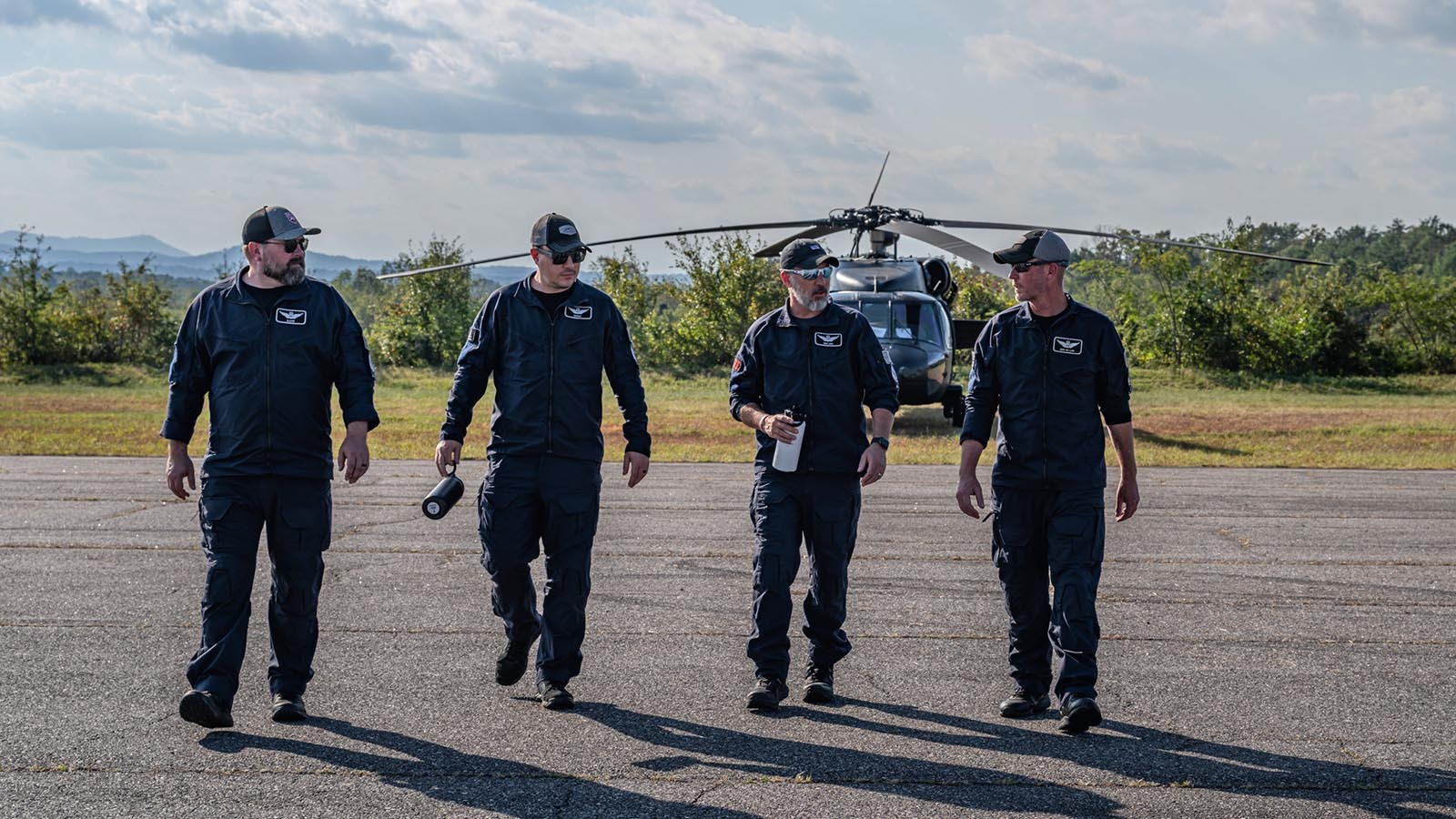 Pilots Sam Sutton, from left, Cory May, Alton Lusk and Mark Jay provided hurricane relief for 12 straight days in western North Carolina last month.